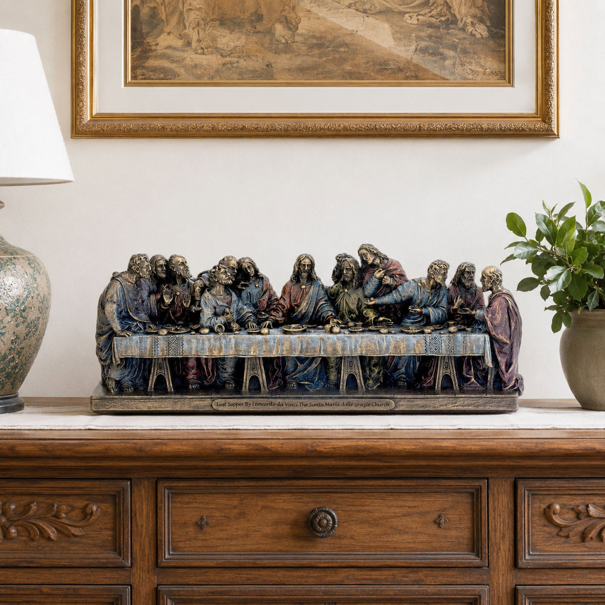 Classical Last Supper Relief Bronze Sculpture, 45cm, polychrome bronze figures on a draped table, displayed on a wooden sideboard beneath a framed painting.