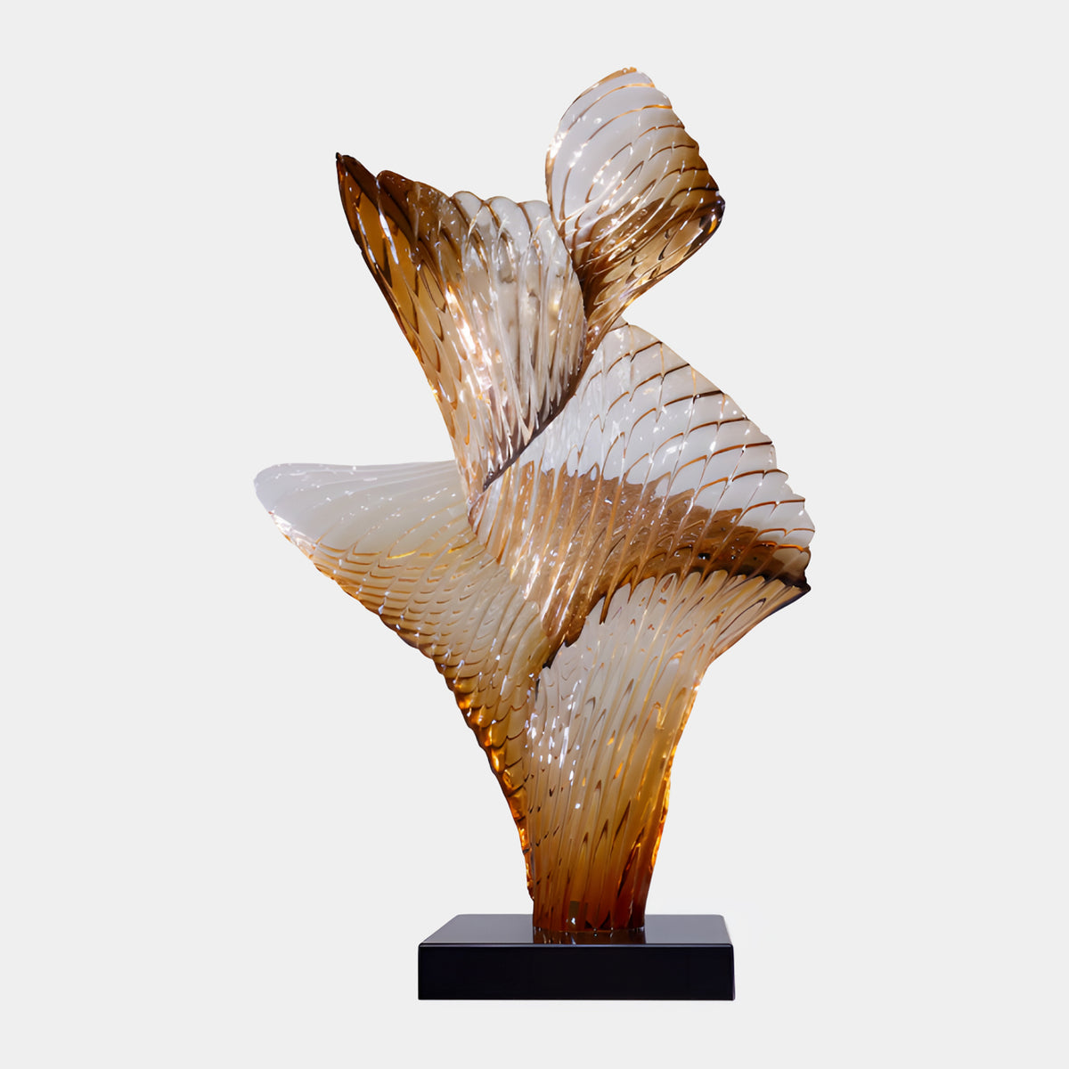 Smoky Topaz Furled Leaf Resin Sculpture on Marble, 102cm, with ribbed golden-brown leaf forms curling upward on a black base, shown against a plain white background.