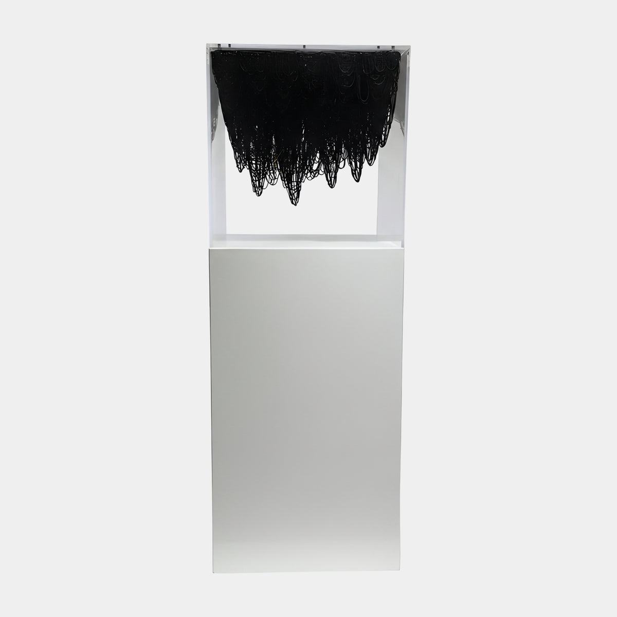 Black Suspended Loop Case Acrylic Sculpture - 131cm, clear acrylic case with dense black looped strands hanging from the top, on a white pedestal against a plain light background.