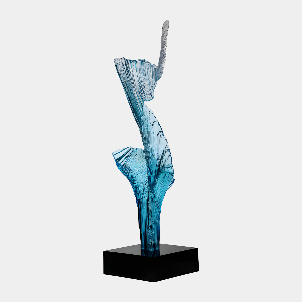 Blue Ribbed Standing Furl Cast Resin Sculpture - 115cm, a ribbed blue resin form twisting upward on a black marble base, shown against a plain white background.