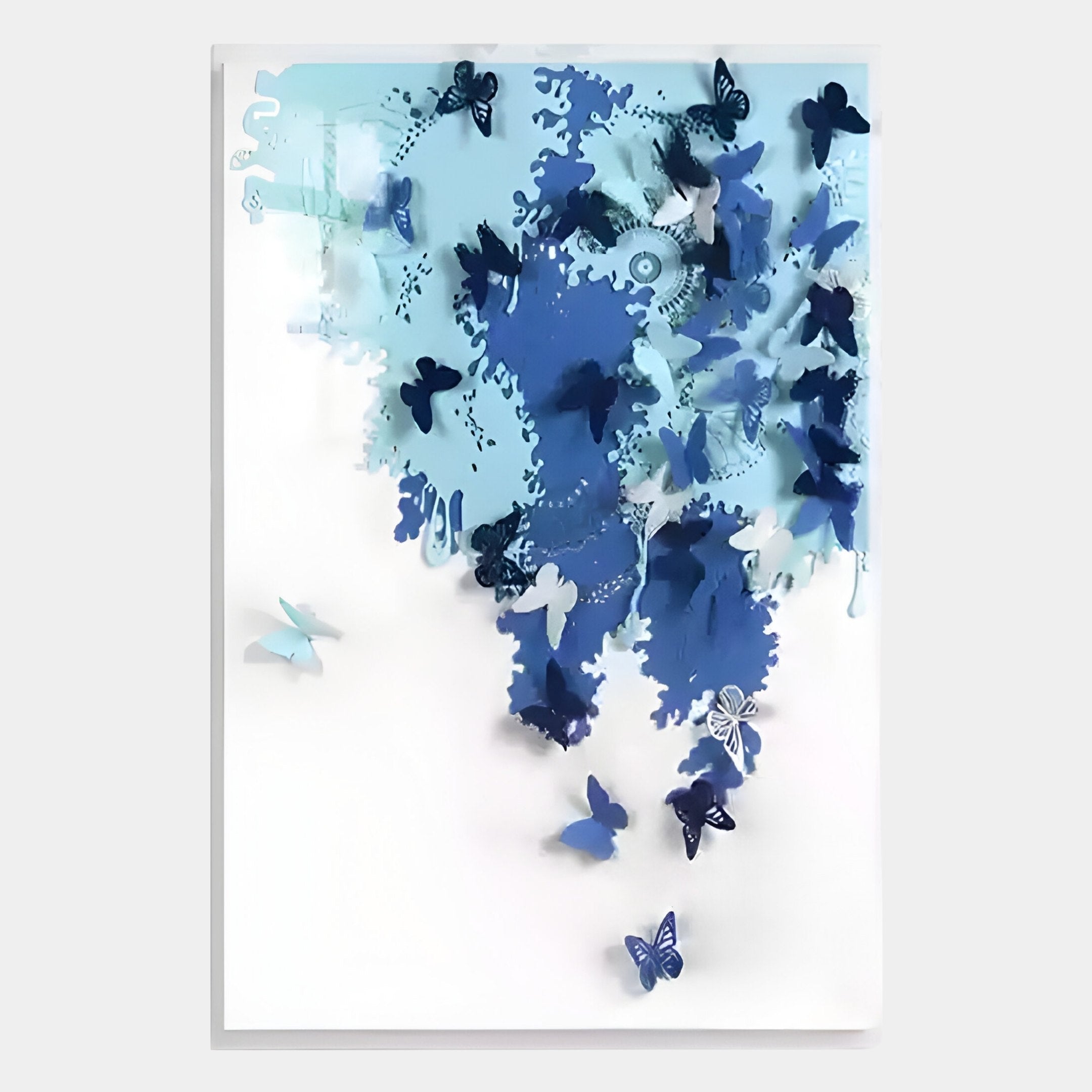 Luminara Blue II Butterfly Paper 3D Wall Art by Giant Sculptures features layered blue cutouts and numerous handcrafted paper butterflies, some appearing to flutter off the white background for a stunning decorative effect.