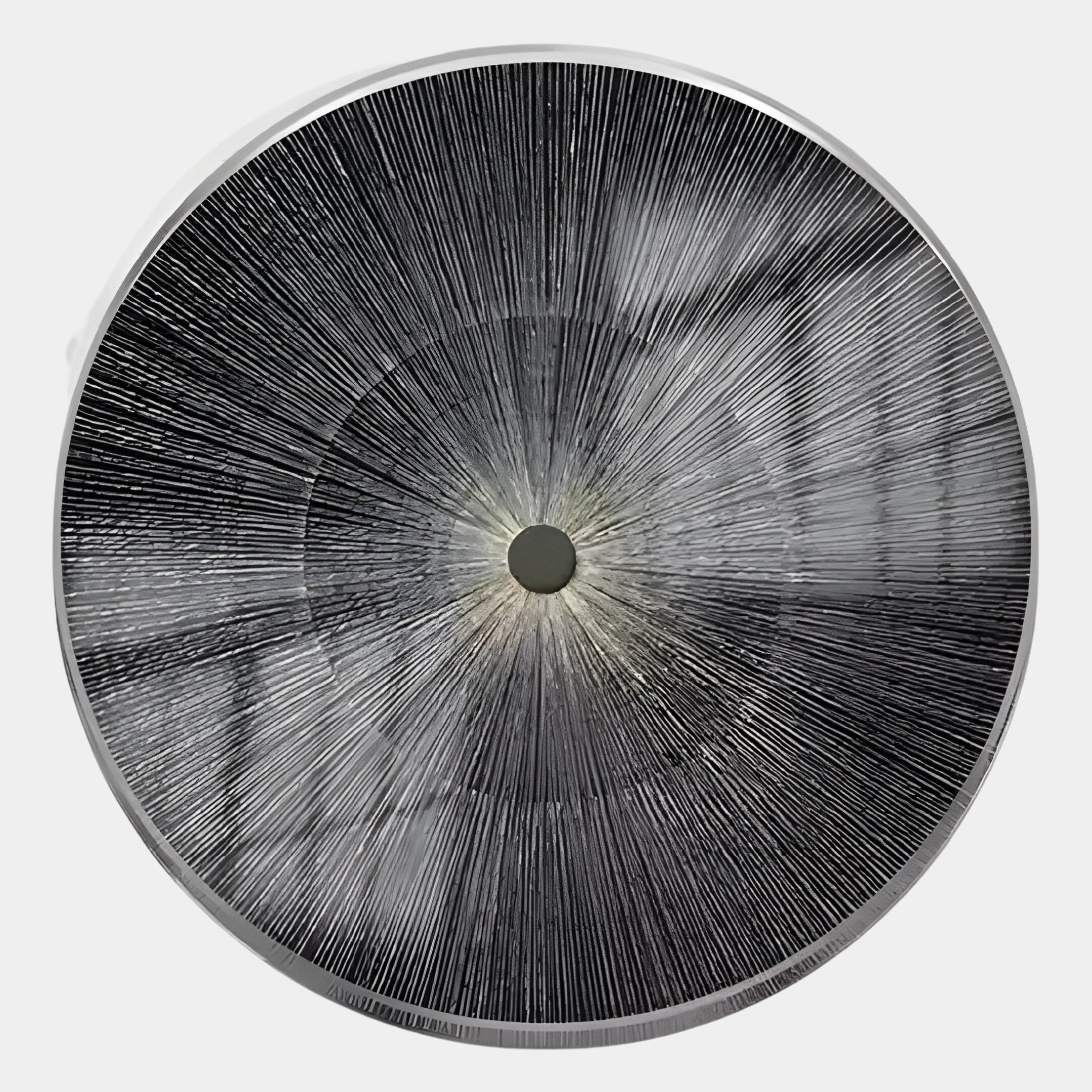 The Oculis Dark Monochrome Circular Handmade 3D Paper Wall Art by Giant Sculptures features bold black and white radiating lines and a textured surface, creating a striking modern minimalist wall accent for your space.