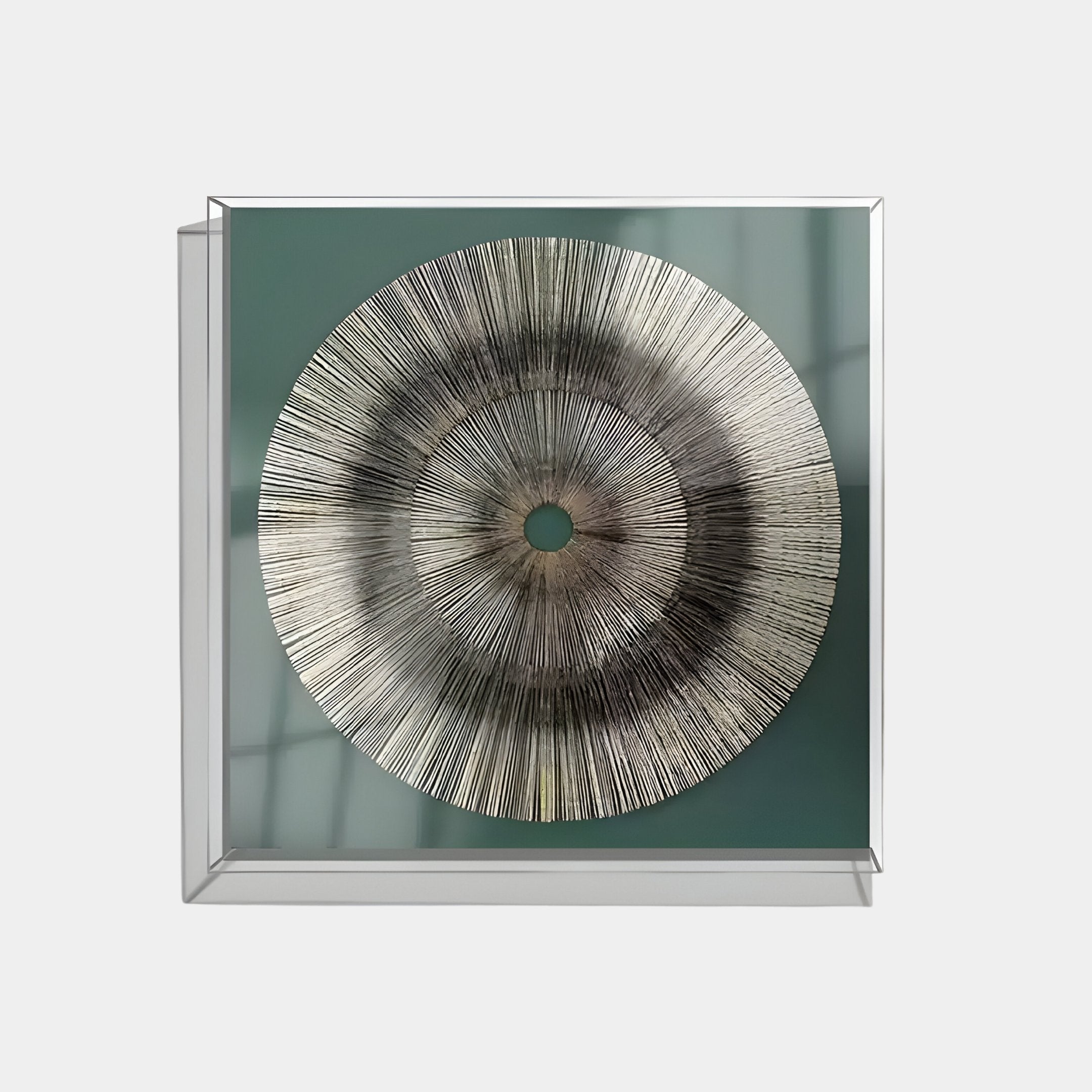 The Oculis Emerald Horizon Square Handmade 3D Paper Wall Art by Giant Sculptures features a circular black and silver sunburst on muted green, set in a modern box frame that casts subtle shadows for striking dimension.