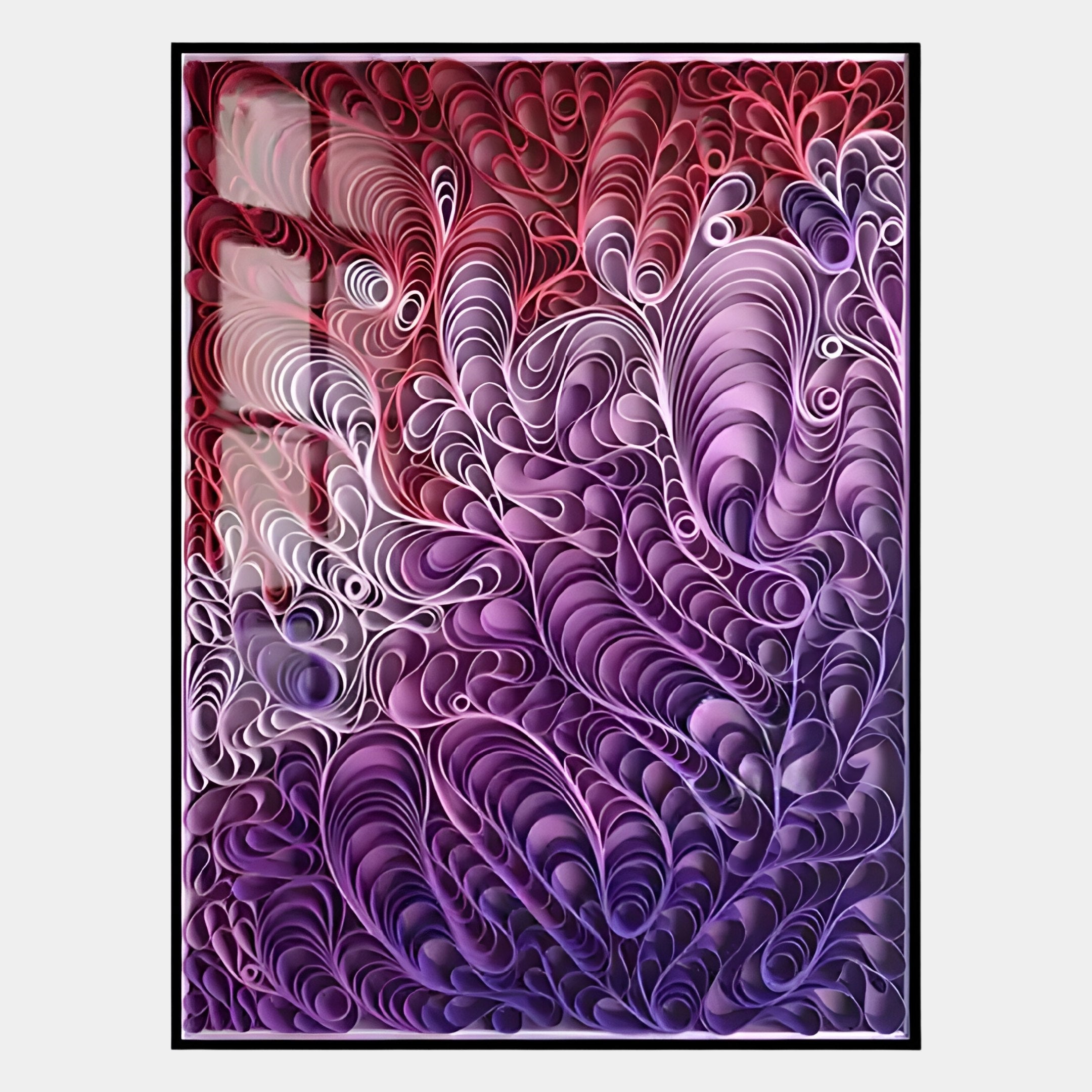 The Filigree Red & Purple Flourish Quilling Paper Wall Art by Giant Sculptures features framed abstract swirls in red, pink, purple, and white, evoking the intricate elegance of organic wave-like quilled designs.