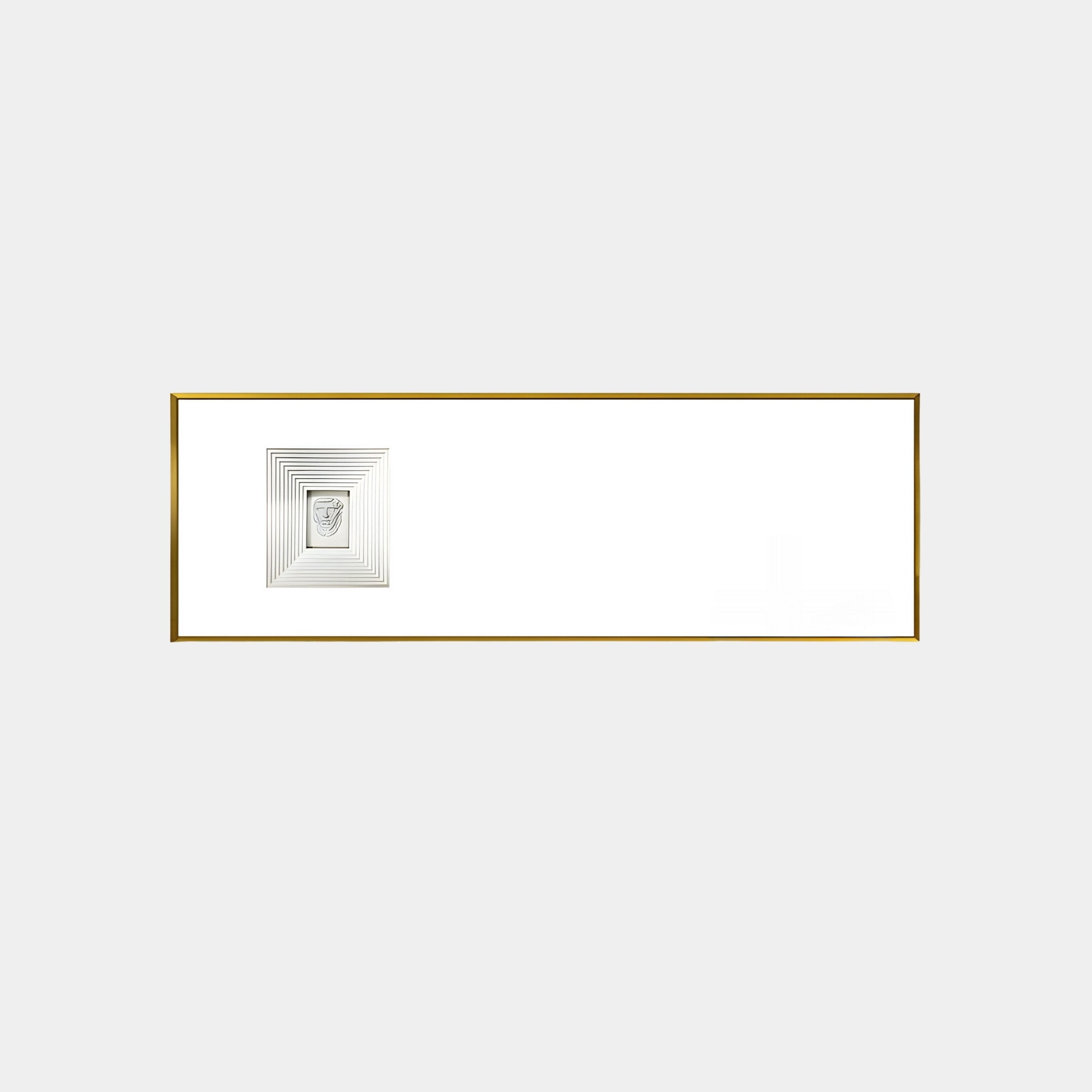 A white minimalist wall displays the Lustreline White Left Plaster Statue Cardboard Wall Art by Giant Sculptures, featuring a black-and-white artwork with concentric square lines and a thin gold edge, enhanced by cardboard layers that add depth to the blank background.