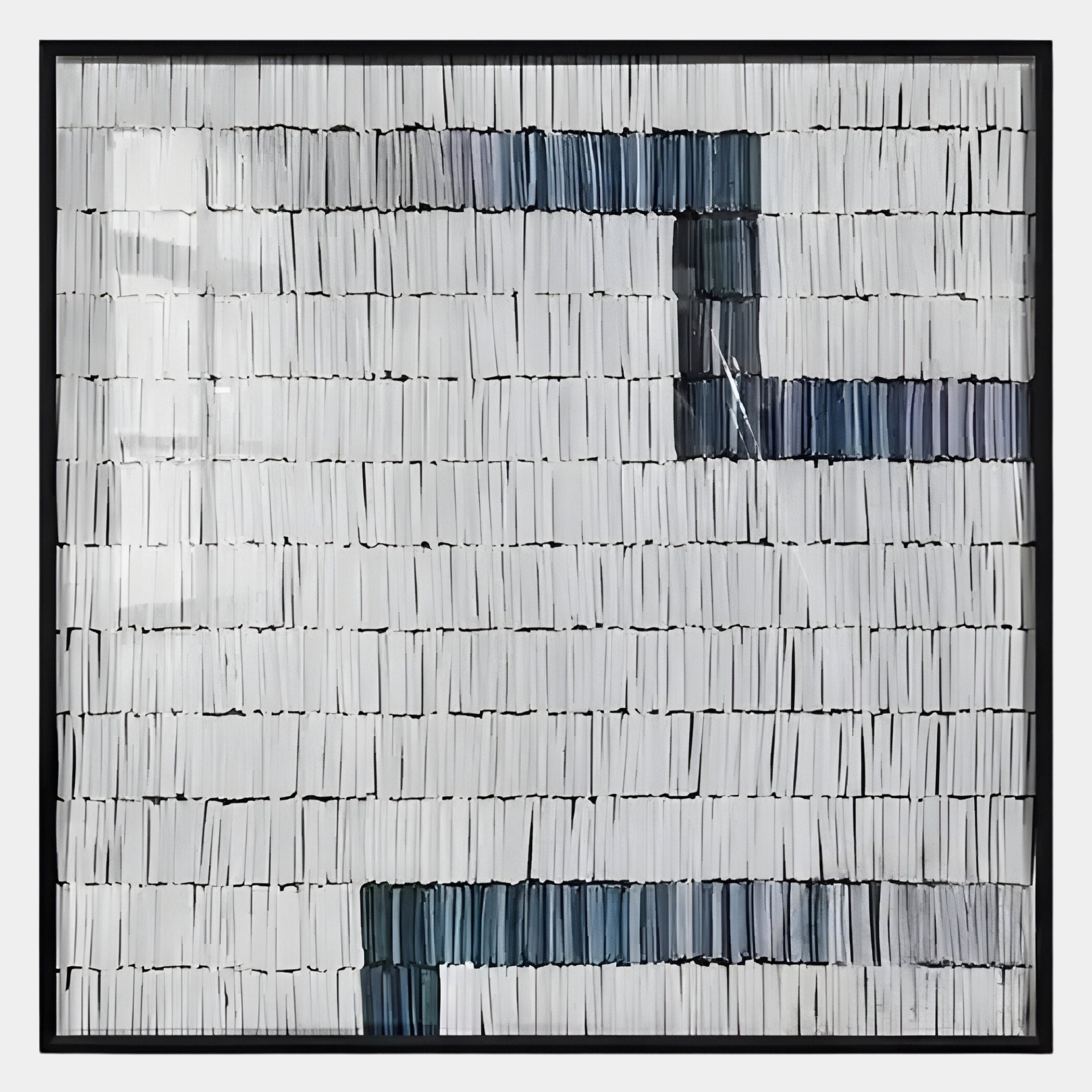 The Tracery IV Blue & White Textured Paper Wall Art by Giant Sculptures features rows of vertically stacked white books with dark blue and gray accents, creating a minimalistic, geometric look perfect for modern interiors.
