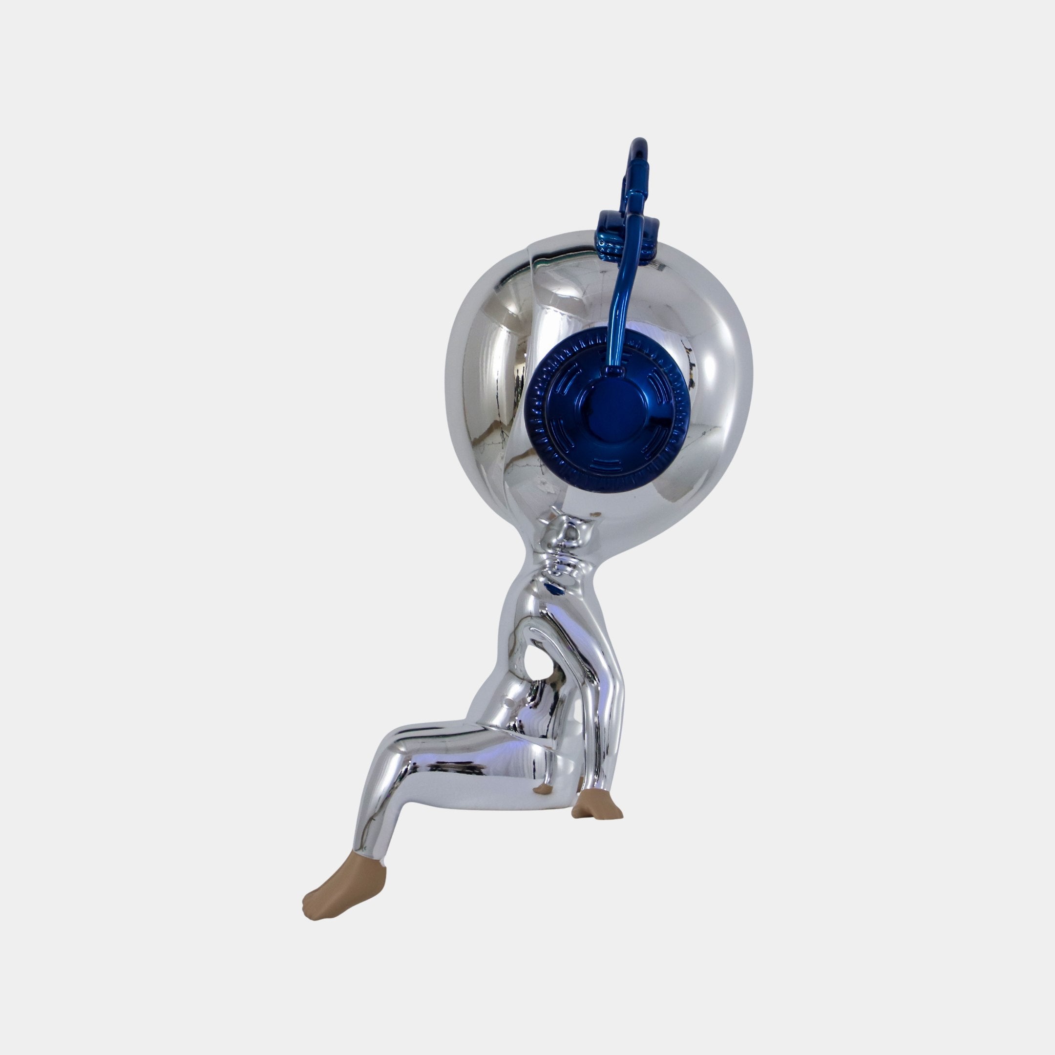 The Midnight Chrome Alien Beats Figure - 55cm by Giant Sculptures is a futuristic chrome sculpture with beige feet and hands, a round blue lock-like head, perfect as modern decor against any plain white background.