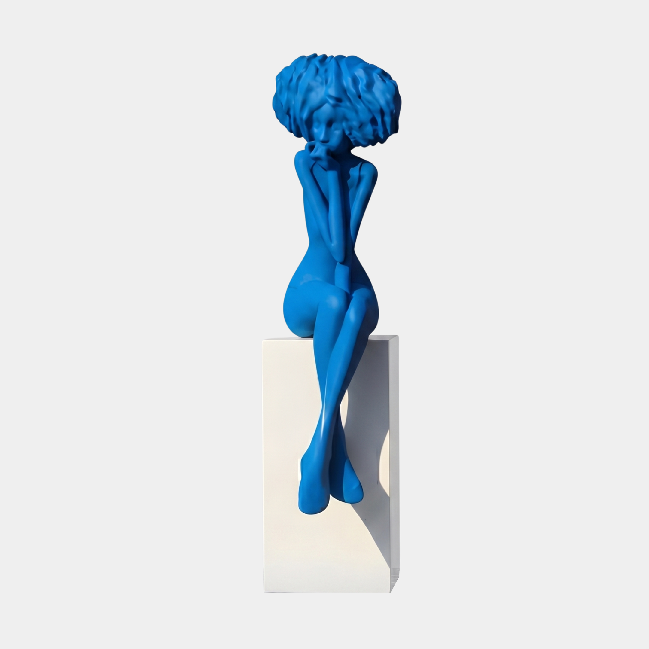 Giant Sculptures Blue Abstract Female Figure with Floral Head Sculpture 145cm, seated in a contemplative pose on a white plinth against a pale background.