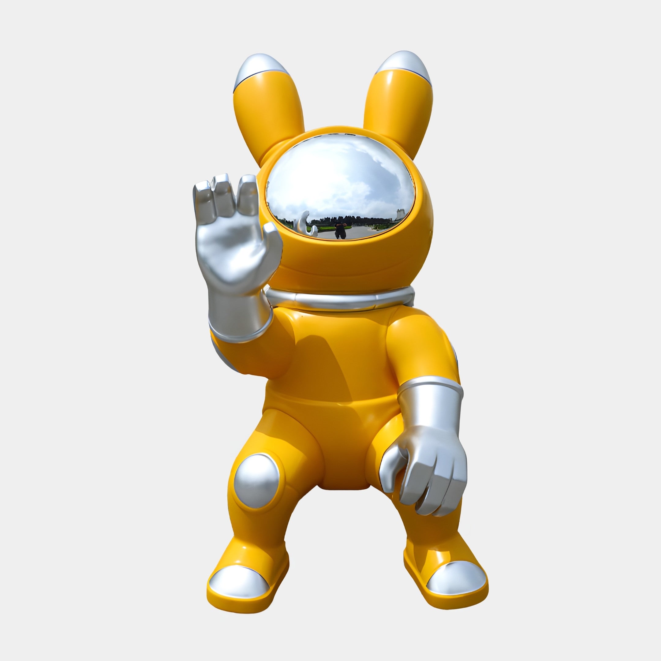 Giant Sculptures Yellow Astronaut Bunny Figure Sculpture 130cm in glossy yellow resin with chrome helmet, gloves and boots, waving against a plain background.