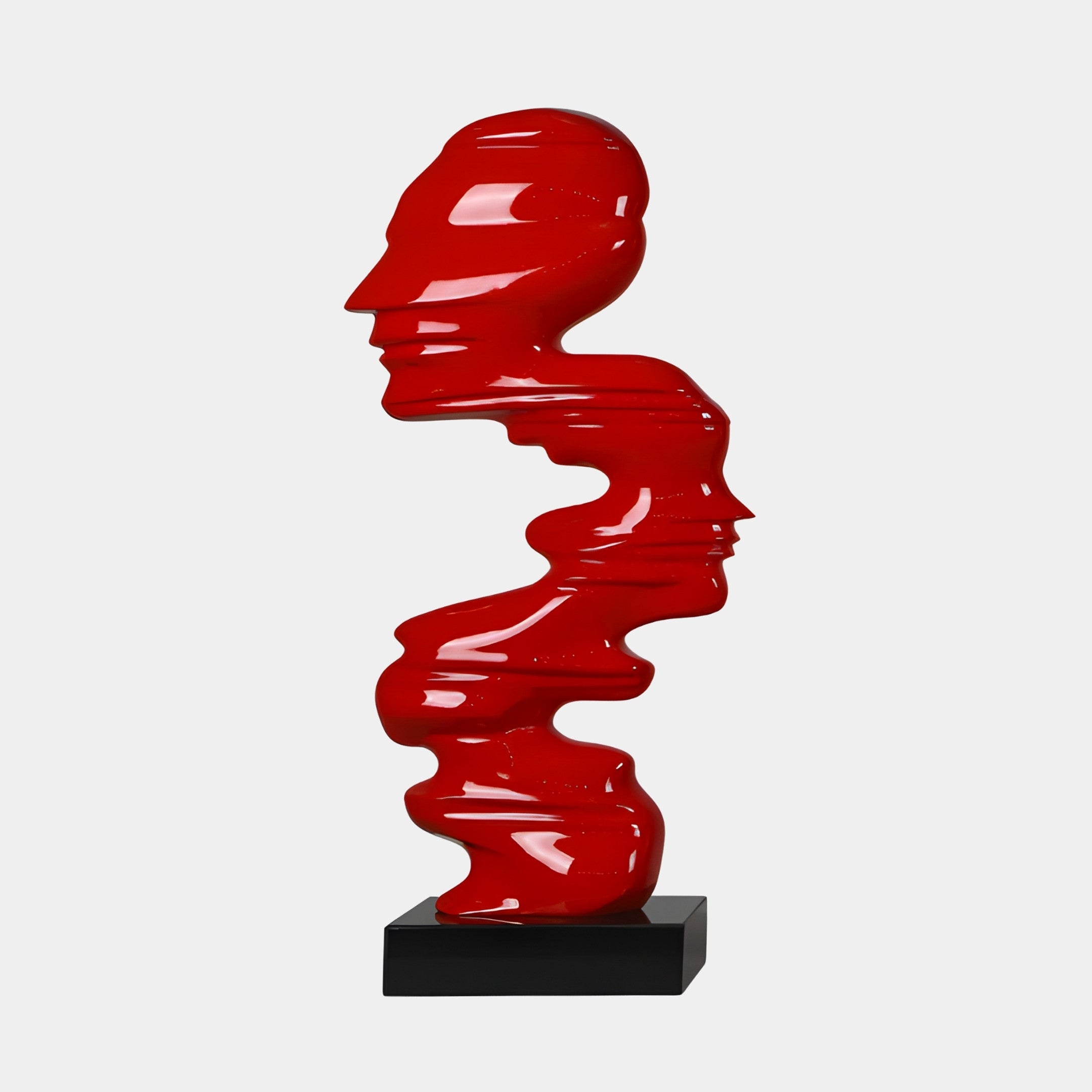 Giant Sculptures Red Abstract Stacked Faces Sculpture in glossy 3D-printed resin, showing human profiles layered in a column on a black marble base.