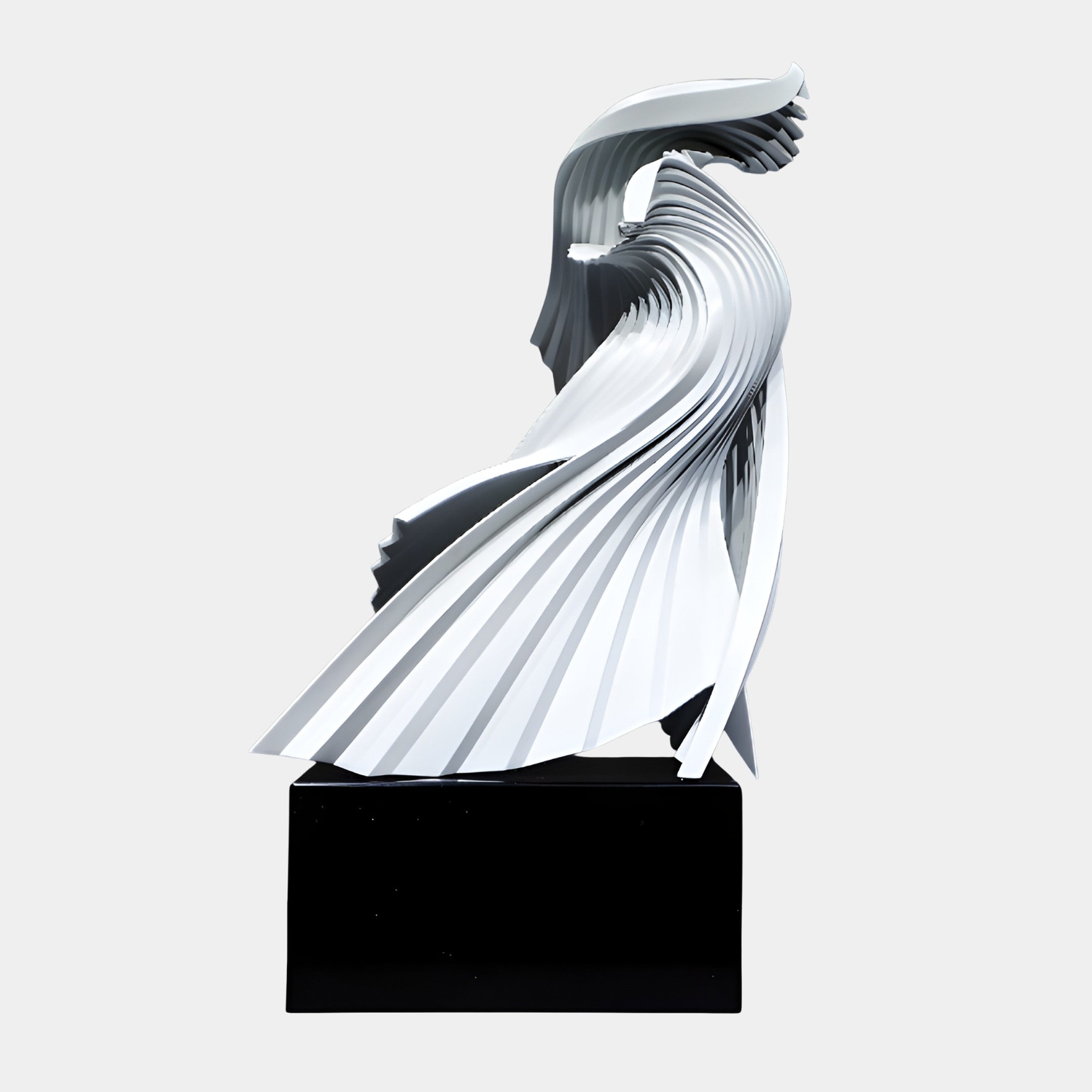 White Abstract Phoenix Rising Sculpture by Giant Sculptures, 54cm, with pleated wings sweeping upward in fanned ribbed layers on a black base, plain background.