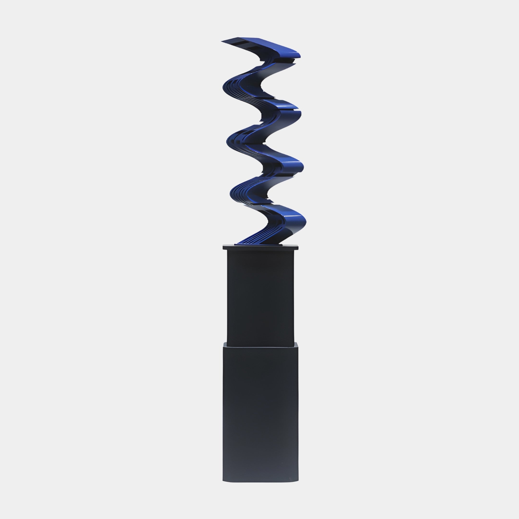 Giant Sculptures Blue Abstract Zigzag Sculpture in glossy 3D-printed resin rising in sharp switchbacks from a tall black plinth against a plain background.