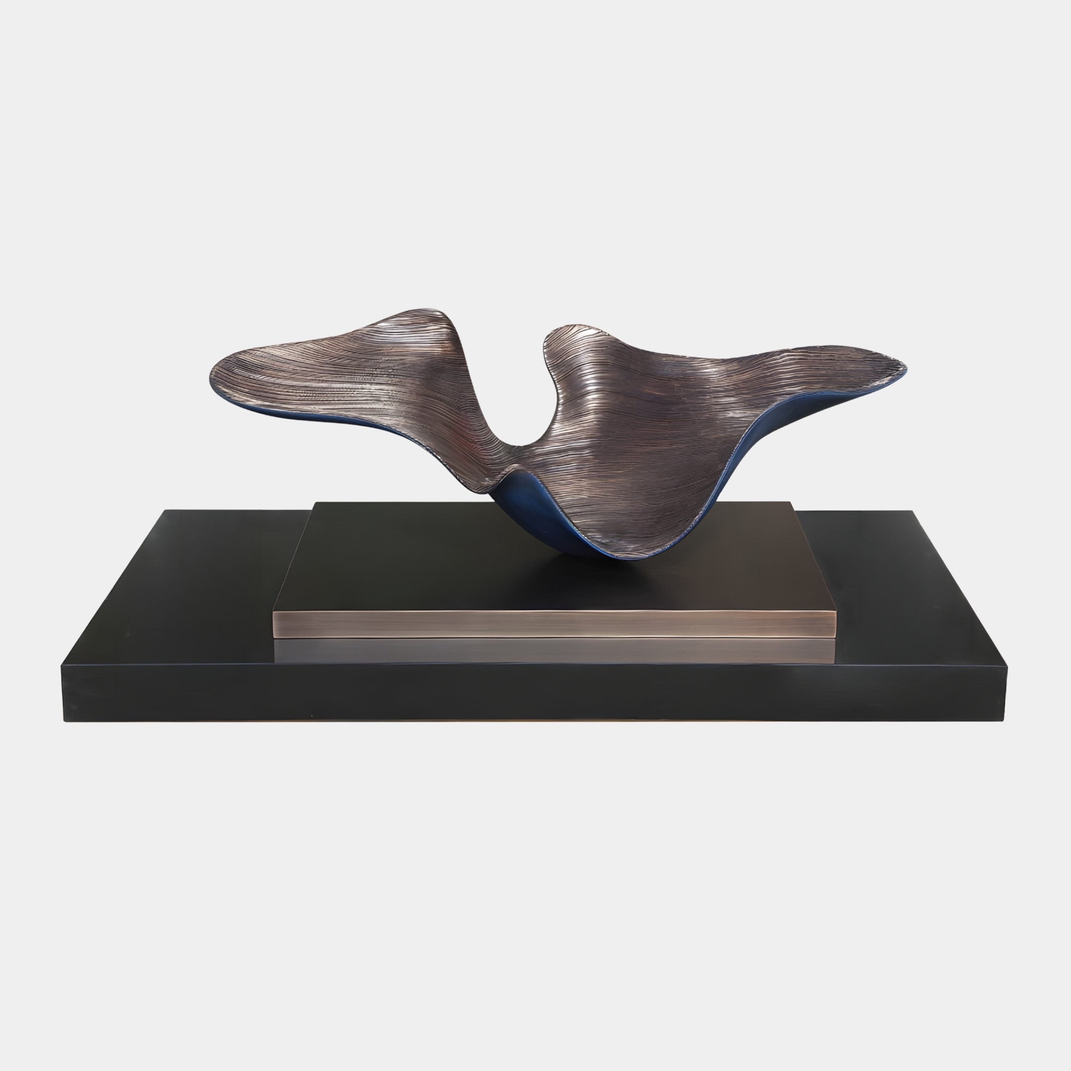 Brown Abstract Whale Tail sculpture by Giant Sculptures, with combed bronze texture and deep blue underside, displayed on a black rectangular base against a white background.