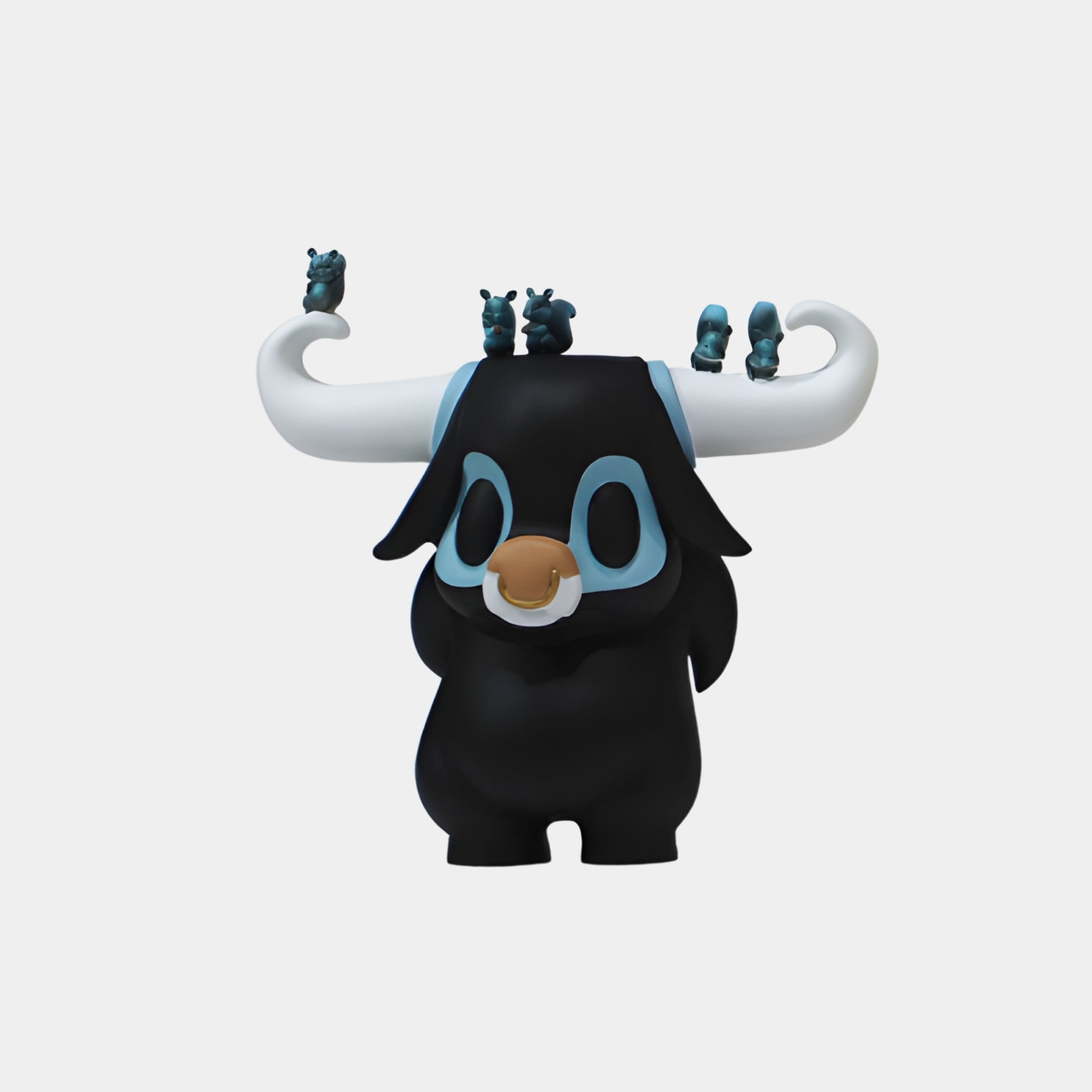Giant Sculptures Black Bull Monster with White Horns 26cm sculpture, chubby black figure with blue eye markings and tiny baby bulls perched on sweeping horns.