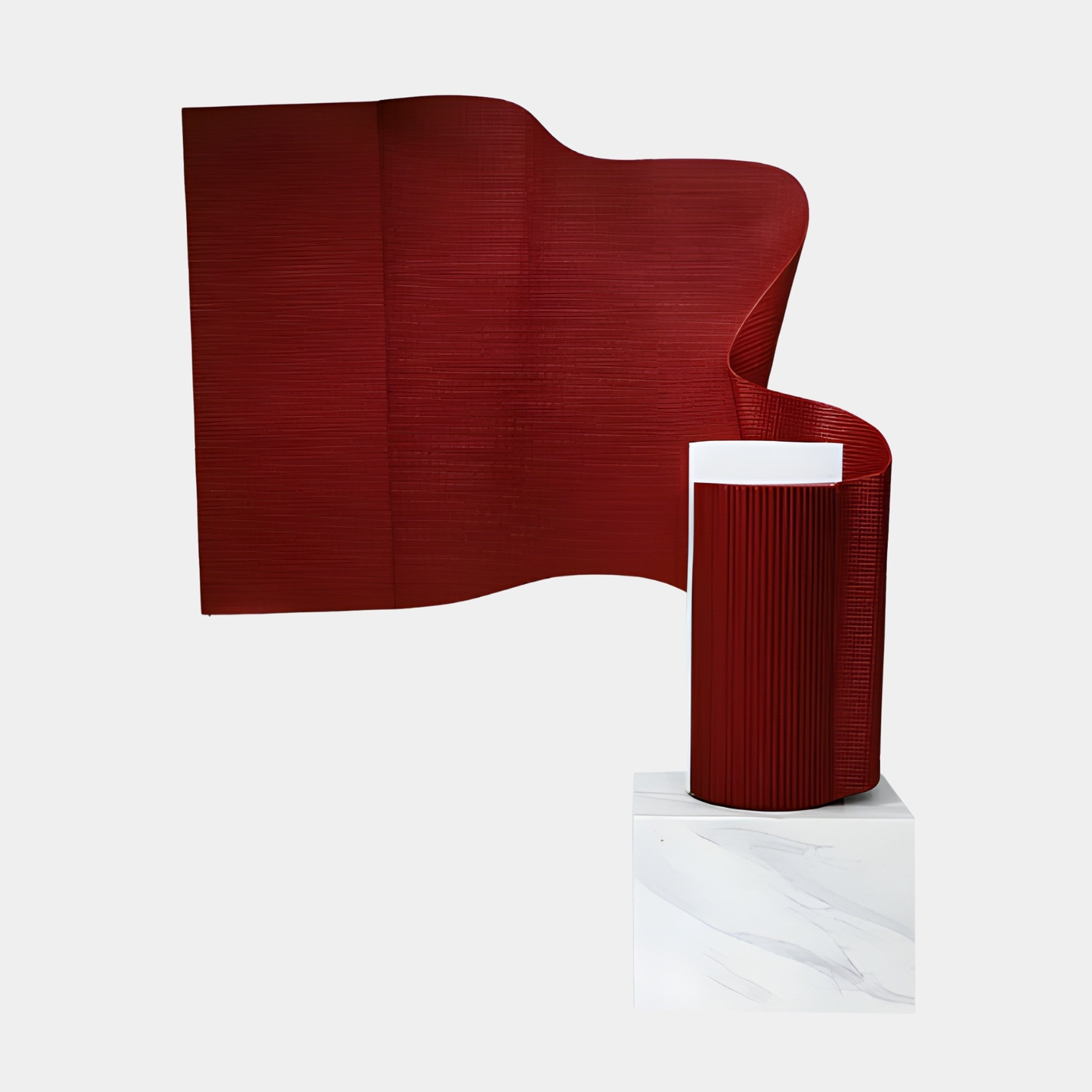 Giant Sculptures Red Abstract Ribbed Wave Panel rising and curling like a wind-caught banner in deep red 3D-printed resin, on a white marble base.