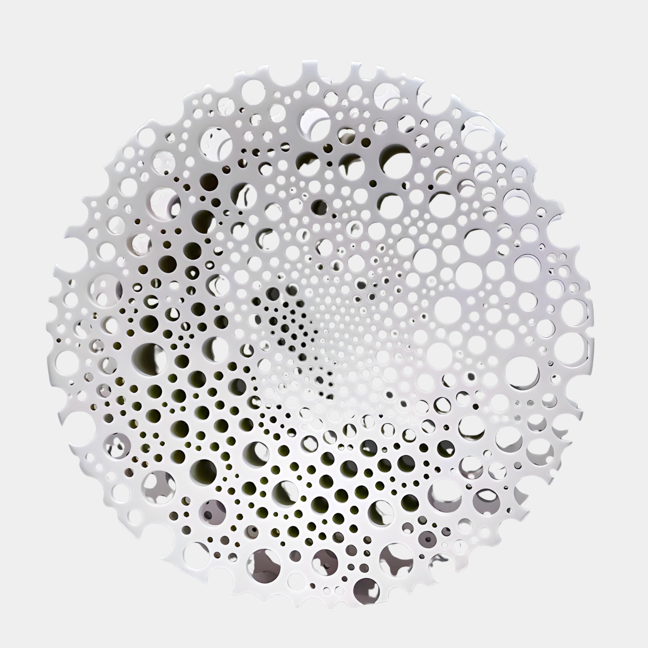 Giant Sculptures White Perforated Circular Disc Sculpture 45cm in 3D-printed resin, with hundreds of graduating holes spiralling from the centre, shown on a light background.