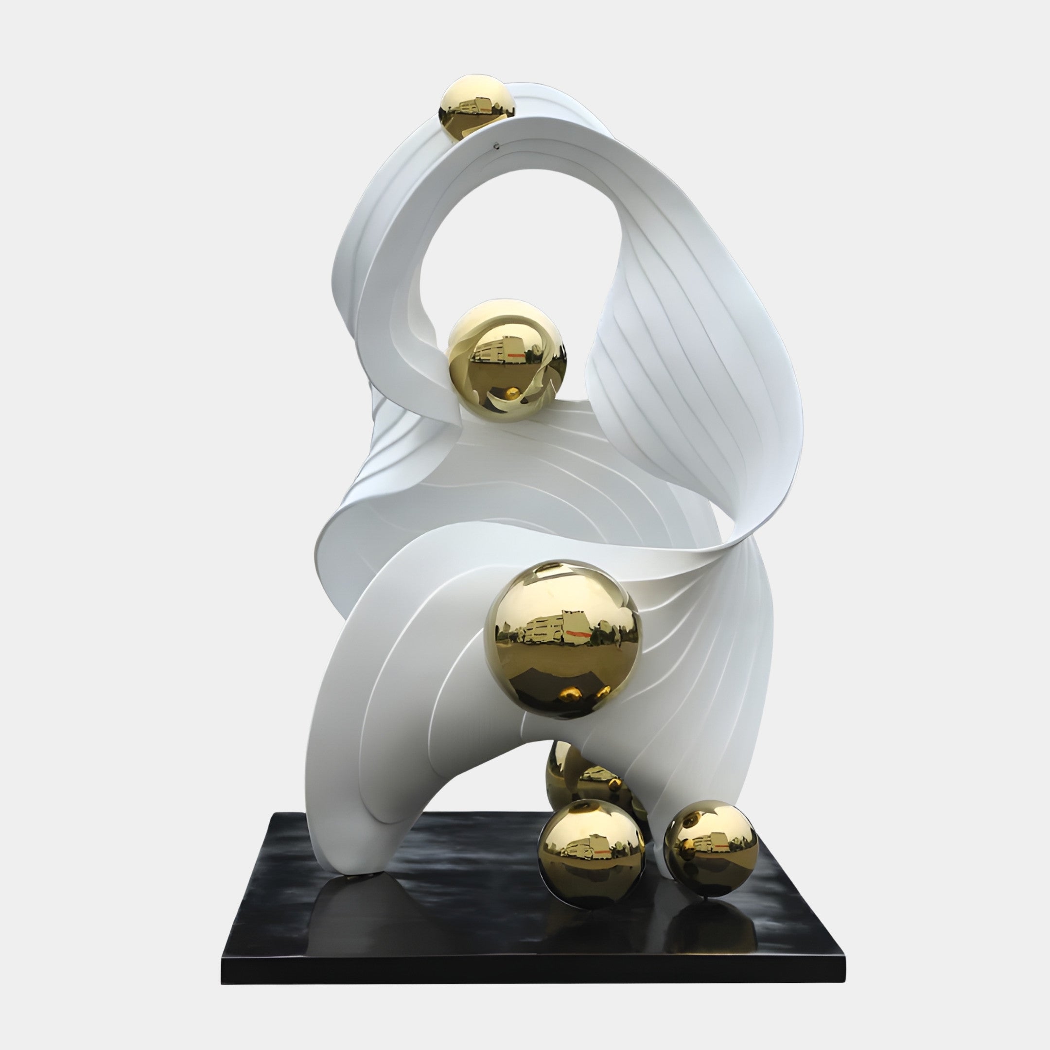White Abstract Swan with Gold Spheres Sculpture by Giant Sculptures, featuring a ribbed fibreglass curved form cradling polished gold spheres on a black base.