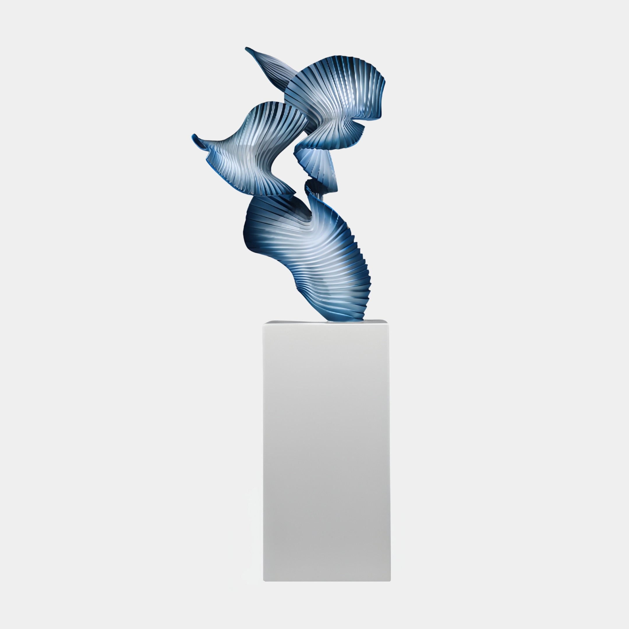 Giant Sculptures Blue Abstract Pleated Fan Wing Sculpture in 3D-printed resin, with twisting ribbed wings in a blue-to-white gradient on a tall white pedestal.