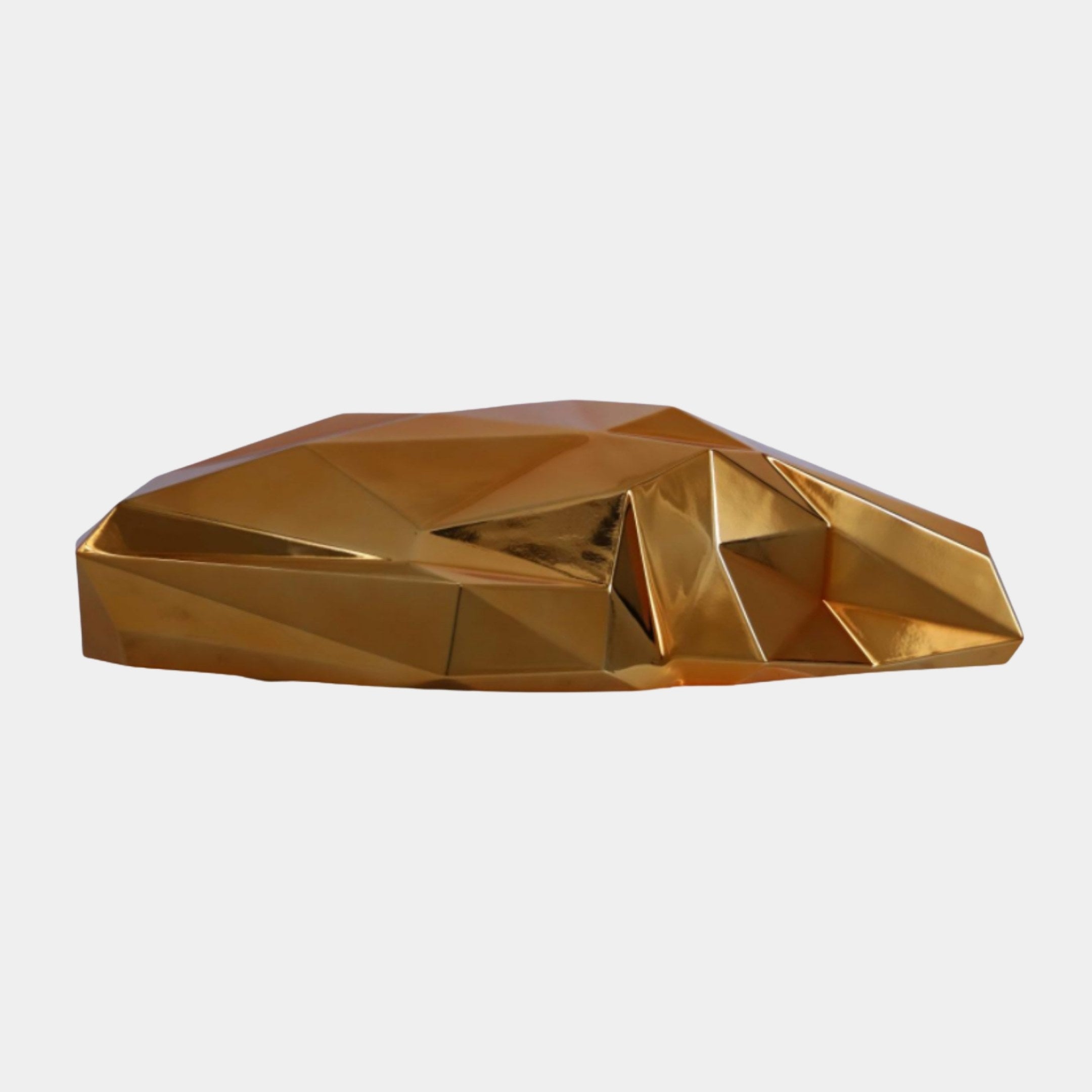 Gold Faceted Geometric Form Sculpture by Giant Sculptures, a 60cm low-profile abstract 3D-printed resin piece with sharp angular planes, shown on a plain white background.