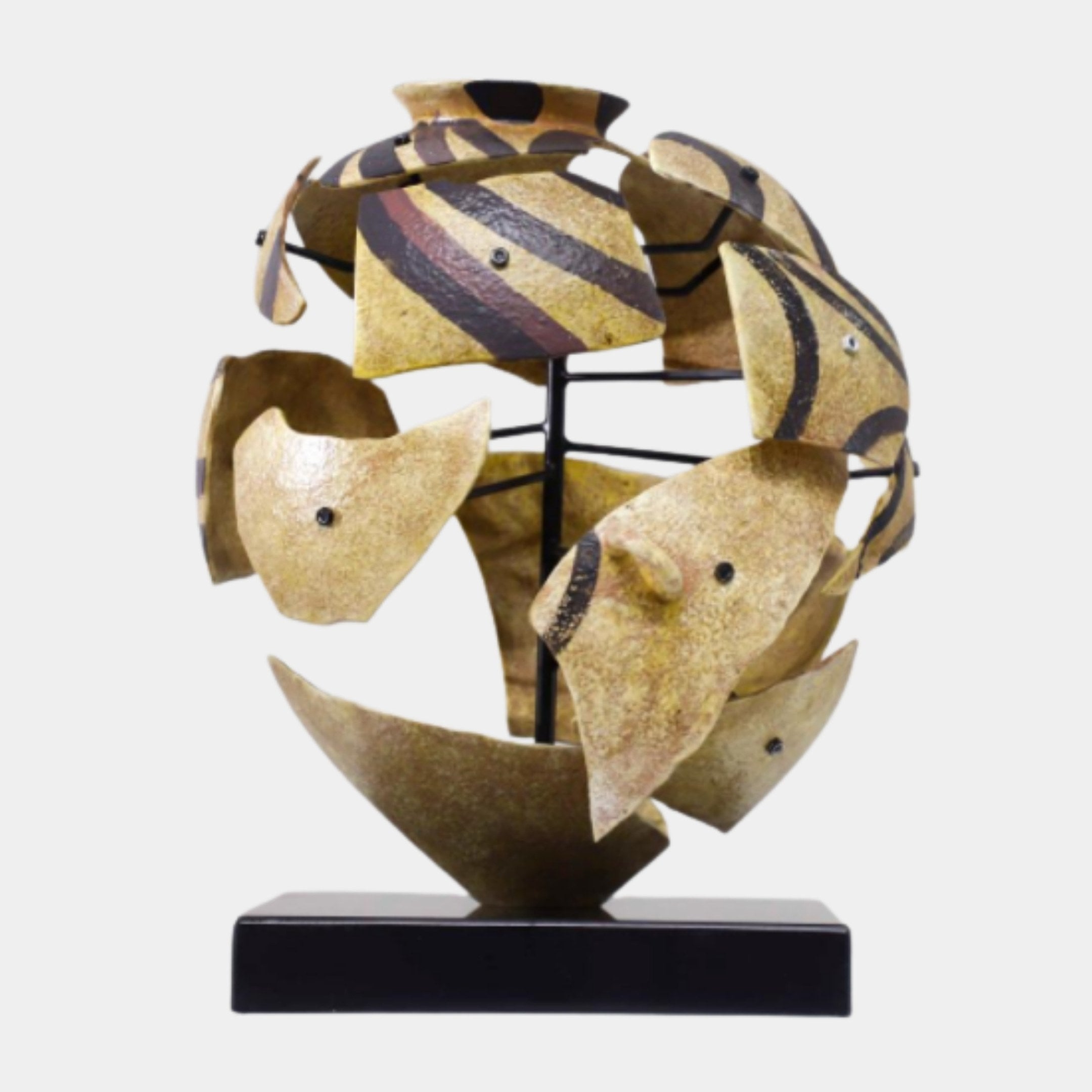 Beige Abstract Geometric Globe Sculpture by Giant Sculptures, fragmented shard-like panels with dark-brown striping forming a deconstructed sphere on a black base.