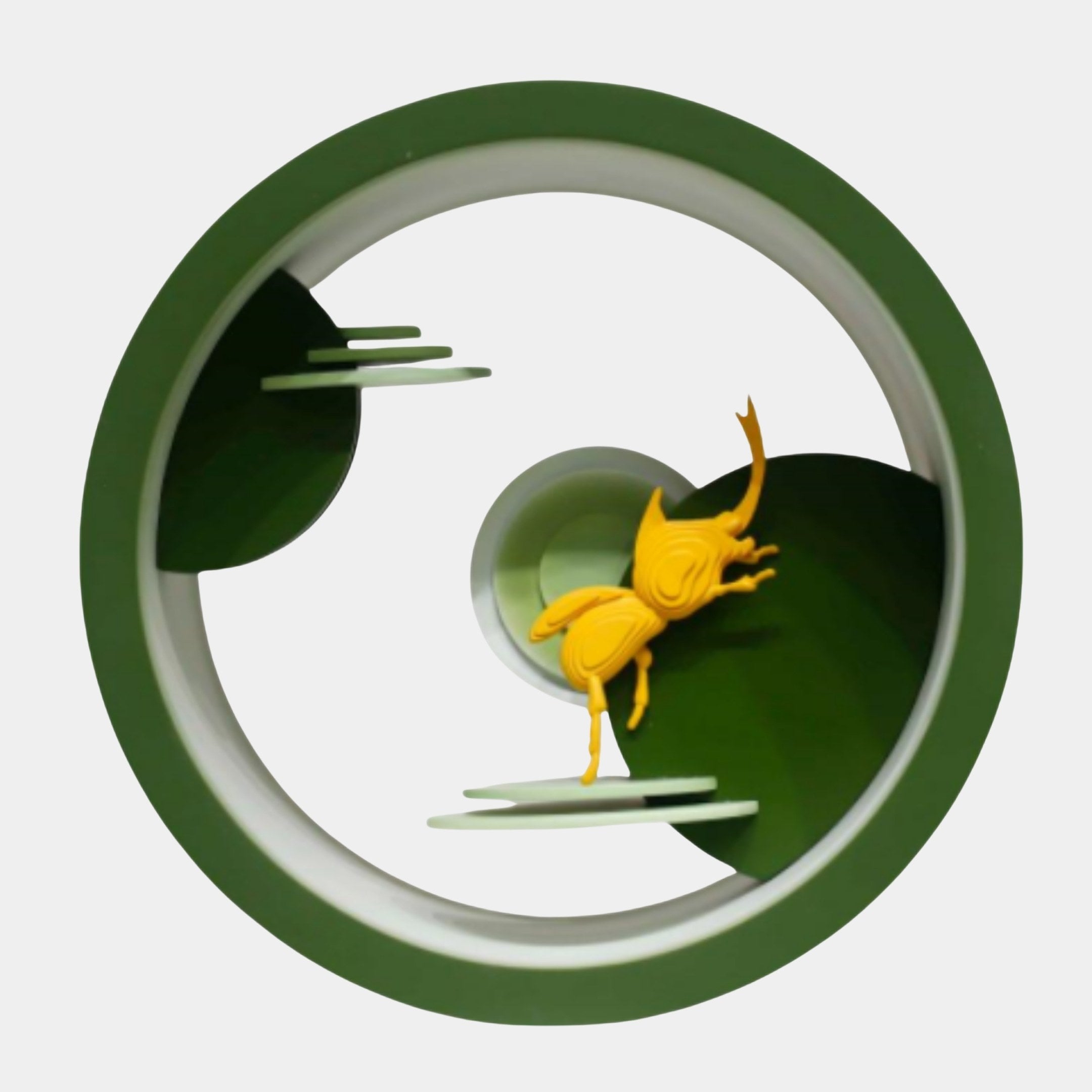 Giant Sculptures Green Circle with Gold Leaping Deer Sculpture 36cm, golden deer mid-leap across layered green hills within a bold green ring, on a plain background.