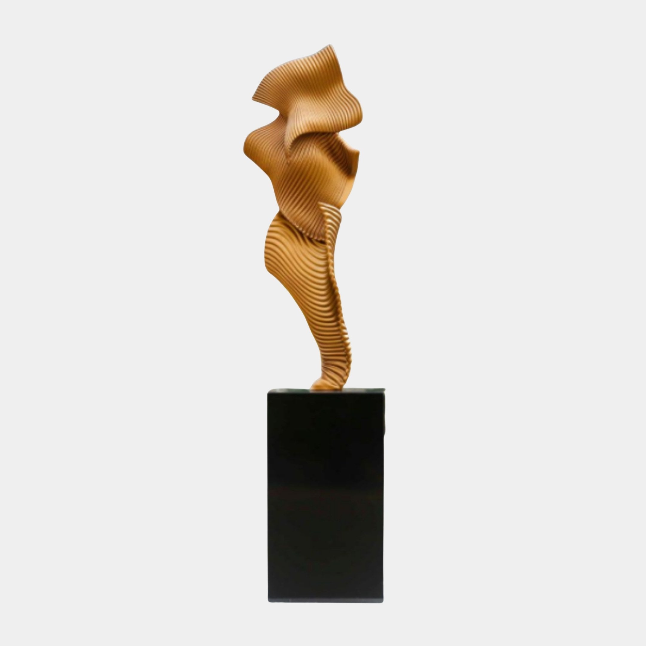 Giant Sculptures Gold Abstract Ribbon Form Sculpture 190cm in 3D-printed resin with pleated ridged folds, on a tall black marble plinth against white.