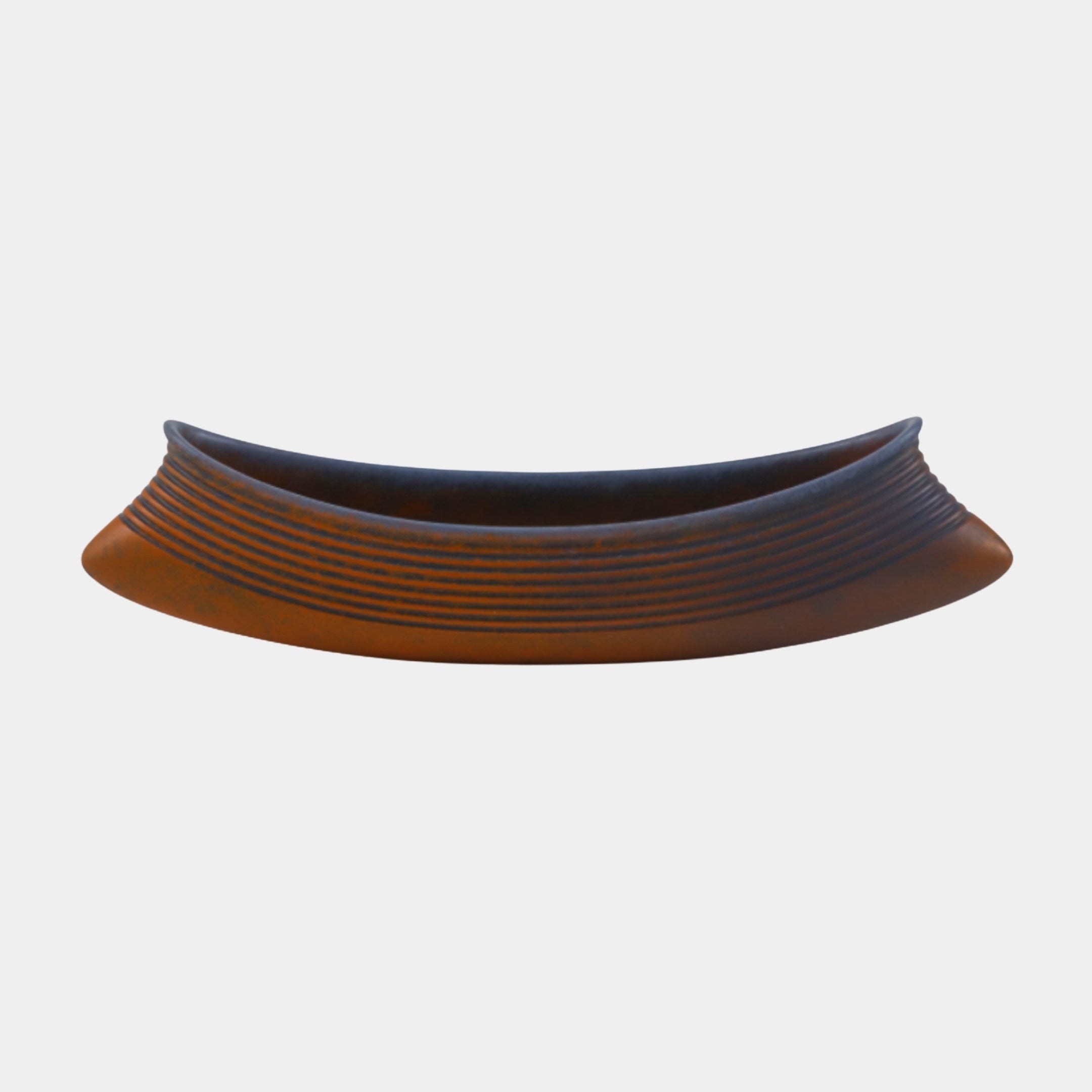 Terracotta Ribbed Boat Bowl Sculpture by Giant Sculptures, 22cm, shown side-on with upswept pointed tips, ribbed orange exterior and dark blue interior.