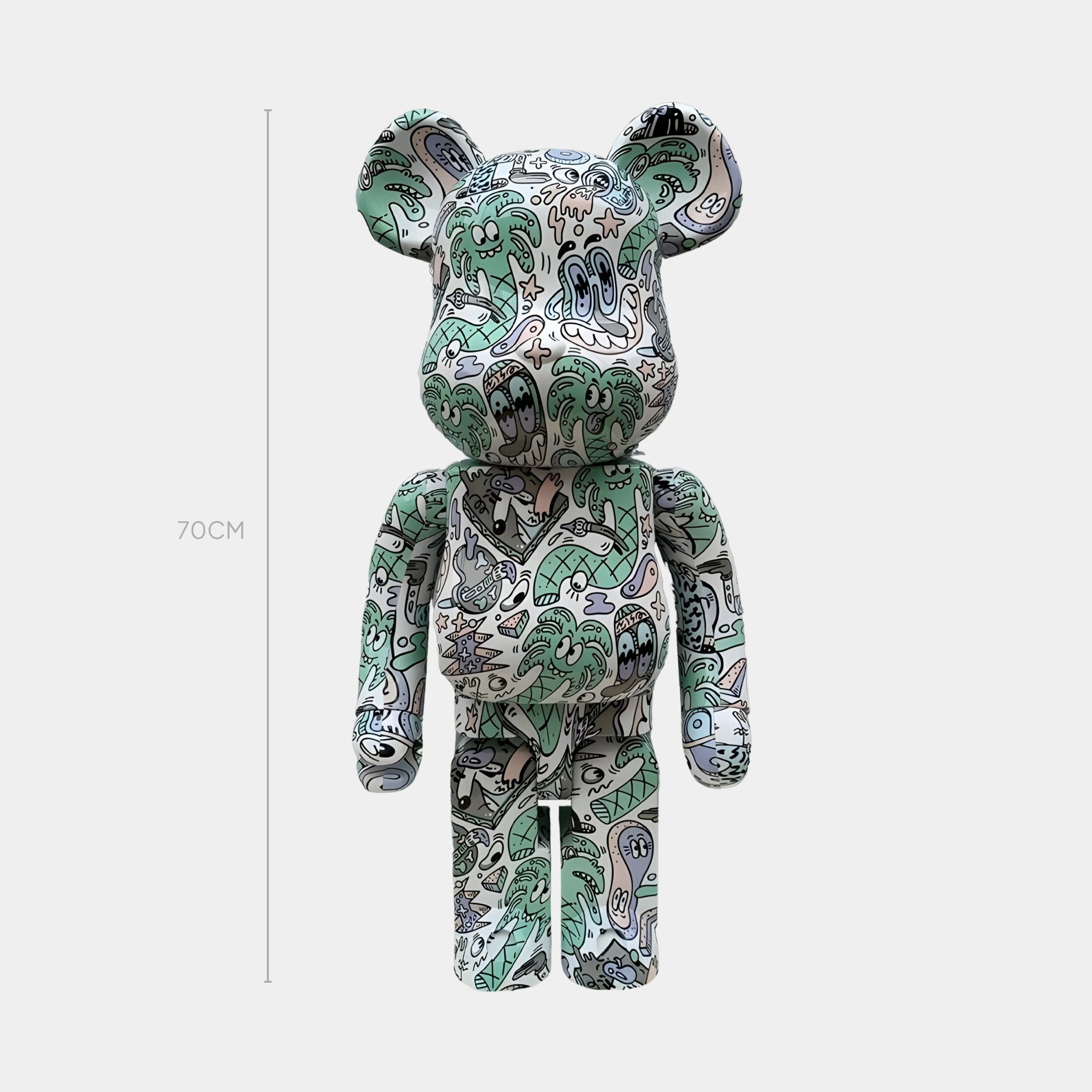 The Doodle Print Bear Sculpture - 70cm by Giant Sculptures features a vibrant pattern of cartoon faces and doodles, adding a playful, modern accent to any interior as it stands upright against a plain white background.