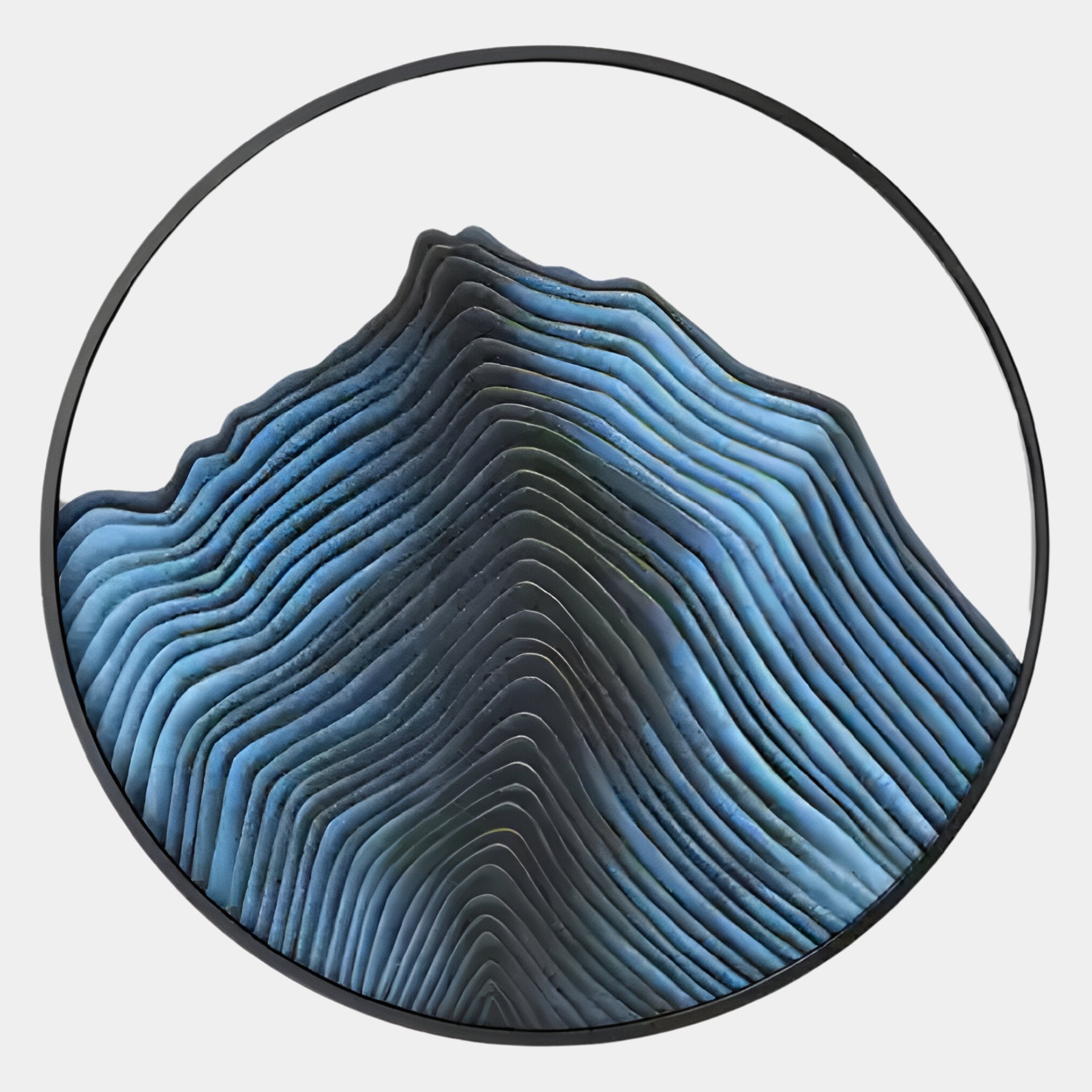 The Auric I Blue Wave Abstract Copper Wire Enamel Round Wall Art from Giant Sculptures features layered, wavy blue and gray contours for a striking, topographic-inspired design that brings abstract mountain landscapes to your wall.