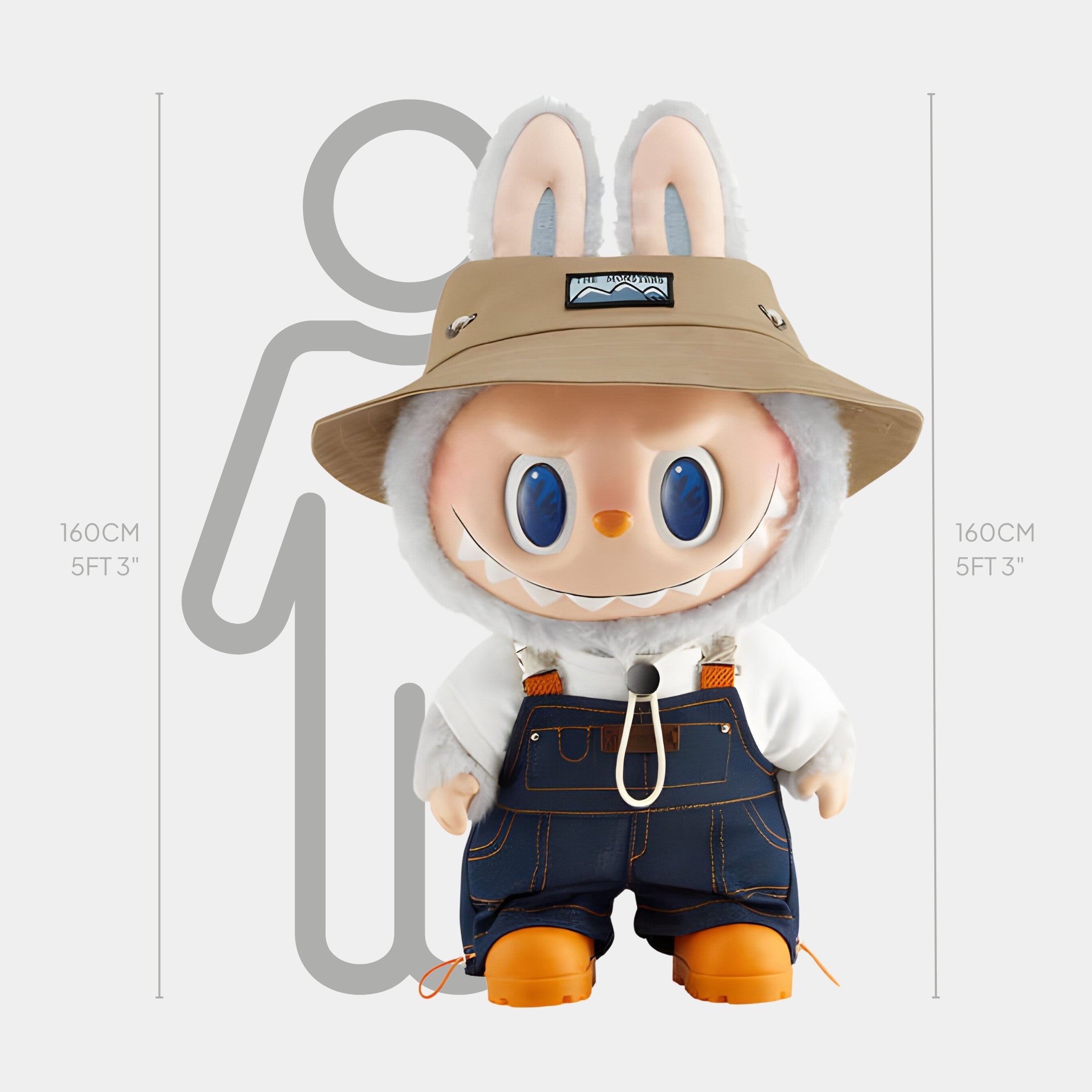 The Monster Fall In Wild Labubu Sculpture by Giant Sculptures is a 160cm bunny doll in safari hat, white hoodie, denim overalls, and orange boots, posed on a fibreglass base before a height chart matching the Monster Fall outline.