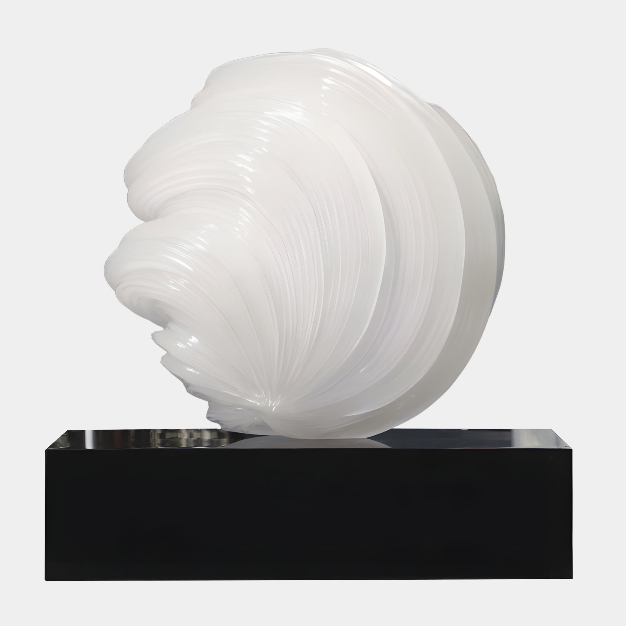 Spiral Shell White Abstract Jade Sculpture 150cm by Giant Sculptures, glossy pearlescent shell with concentric ridges on a black rectangular plinth, plain background.