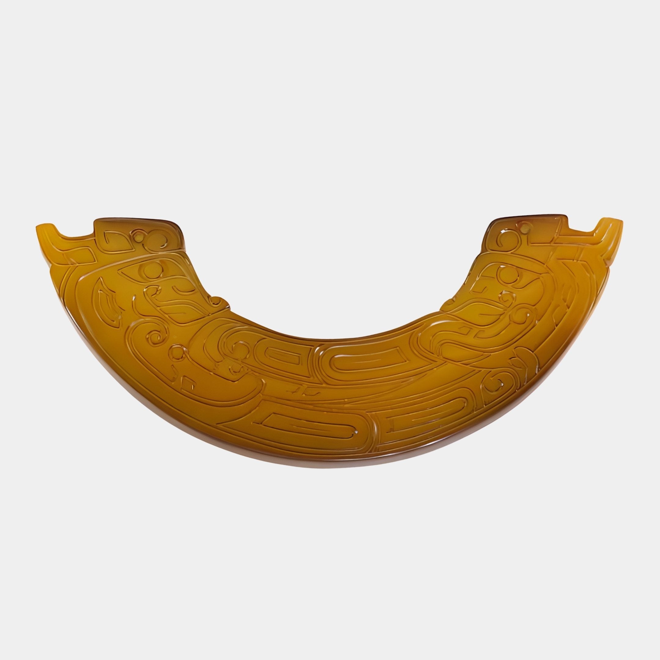 Giant Sculptures Dragon Collar Amber Carved Jade Ornament in a U-shaped crescent form with incised taotie dragon motifs, shown front-on against a white background.