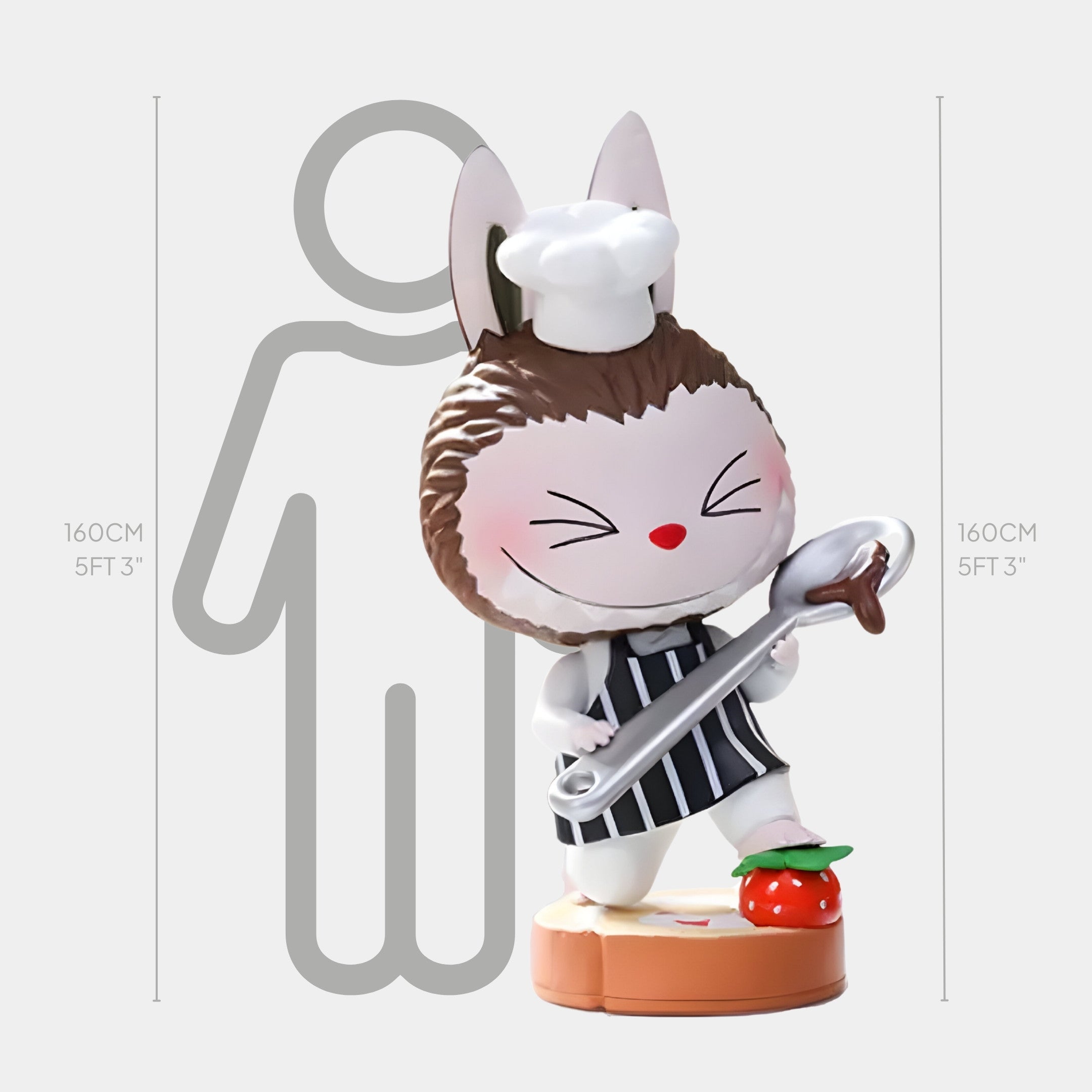 The Sweet Mischief Chocolate Chef Labubu Sculpture by Giant Sculptures stands at 160cm and features a smiling bunny chef with a white hat, striped apron, large spoon, and base with a strawberry, from the Strawberry Cake Labubu Collection.
