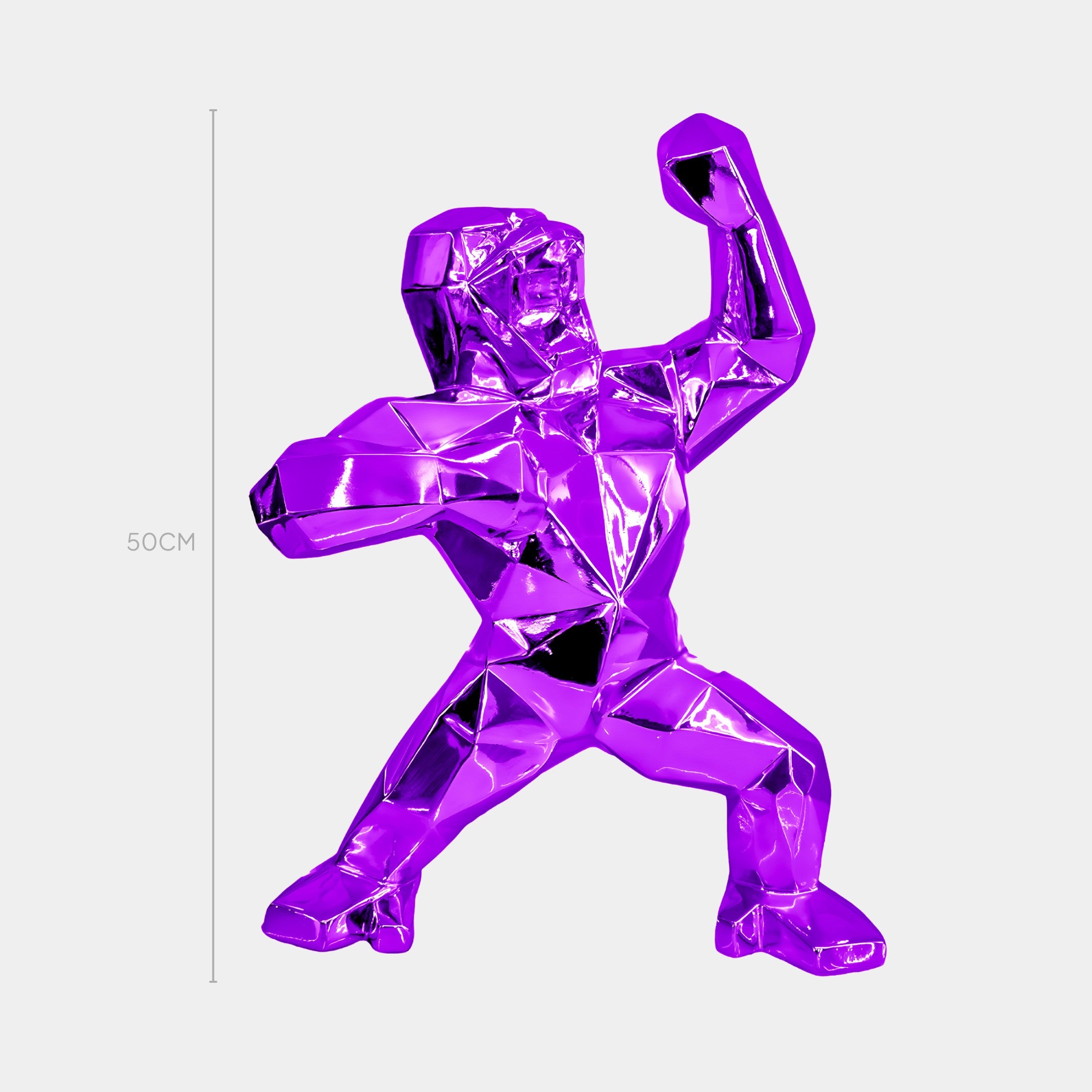 The Phantom Purple Gorilla Sculpture by Giant Sculptures is a futuristic, metallic piece featuring a stylized figure in a dynamic pose with an angular design, triumphantly raising one fist. A vertical line accentuates its regal 50cm height.