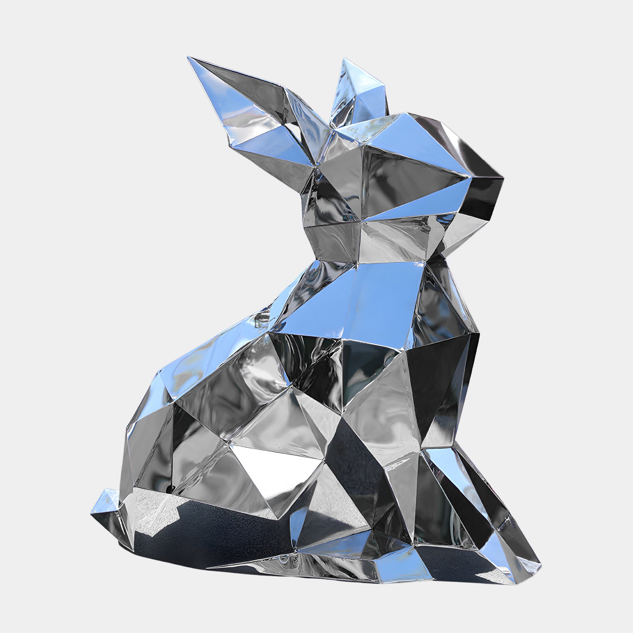 The Coco II Rabbit Steel Outdoor Sculpture by Giant Sculptures showcases a geometric, silver rabbit in an origami style with reflective facets that shine beautifully against a plain white backdrop. Its minimalist design adds a modern touch, making it ideal for both indoor and outdoor displays. Standing 57cm tall, this sculpture captures contemporary elegance perfectly.