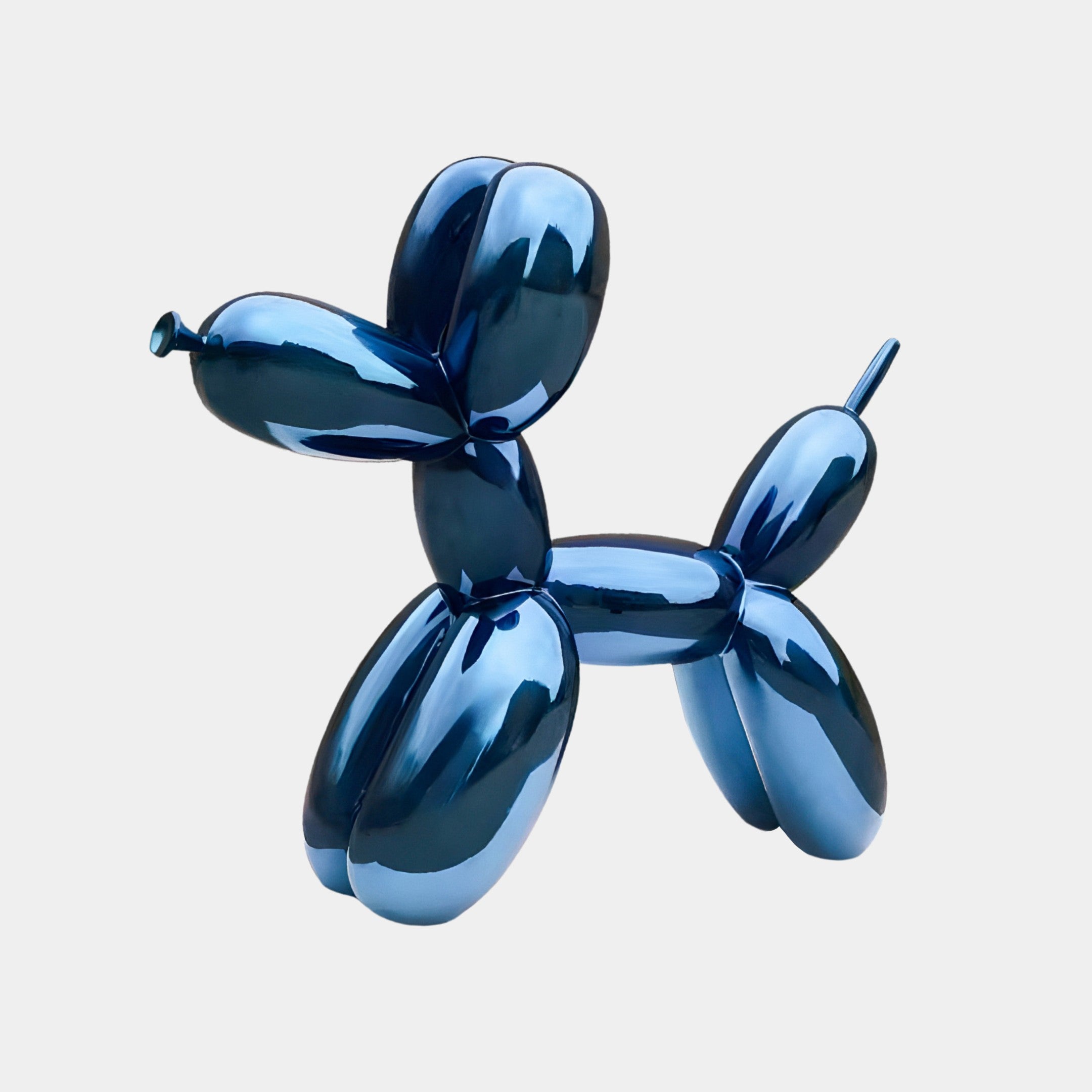 The Sapphire Blue Balloon Dog Sculpture by Giant Sculptures, measuring 80cm, gleams against a plain white background as a striking example of modern design.