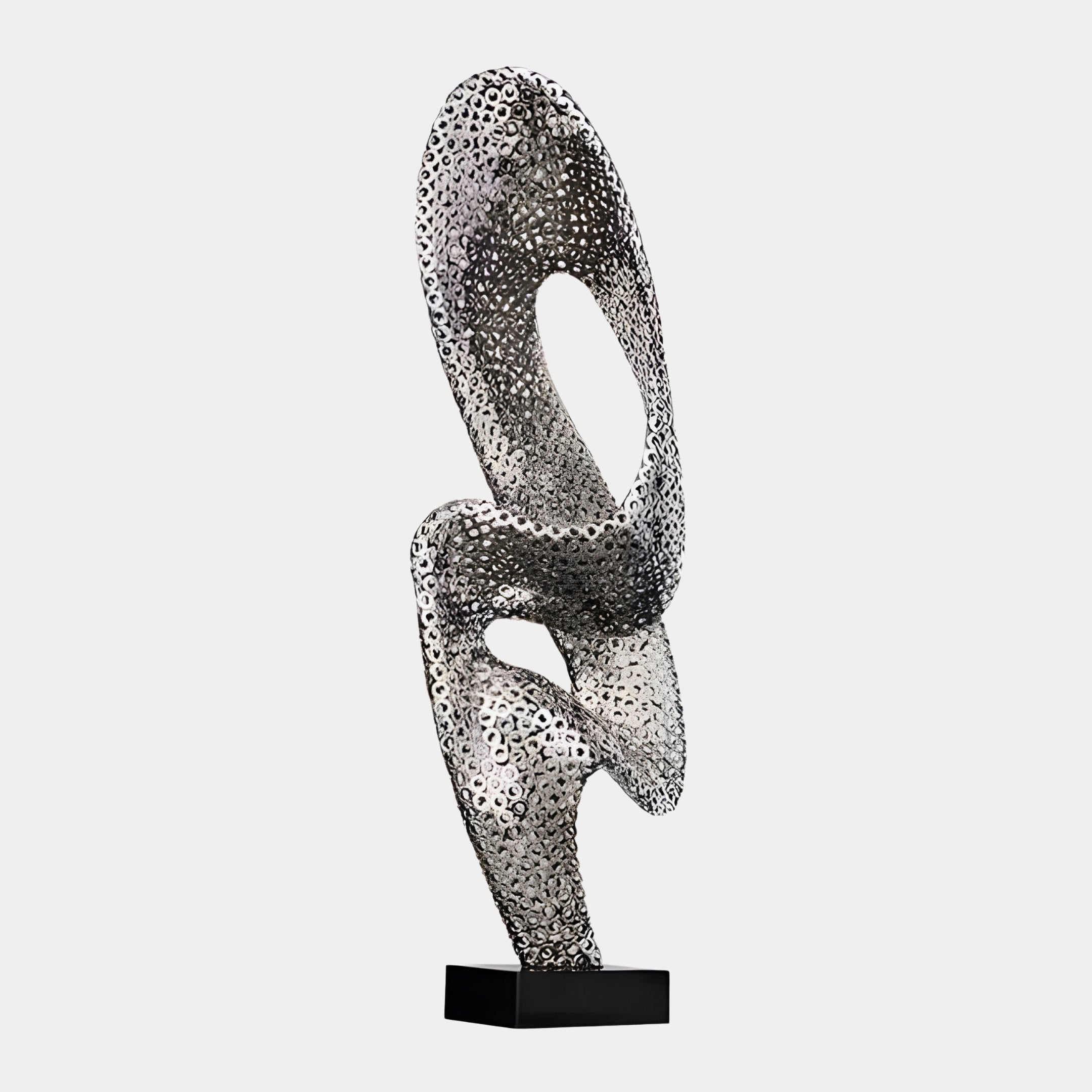 The Solis Silver Abstract Steel Sculpture from Giant Sculptures, measuring 110cm, features interconnected loops and textured, perforated surfaces. It stands elegantly on a black rectangular base against a plain white background, highlighting its modern design.