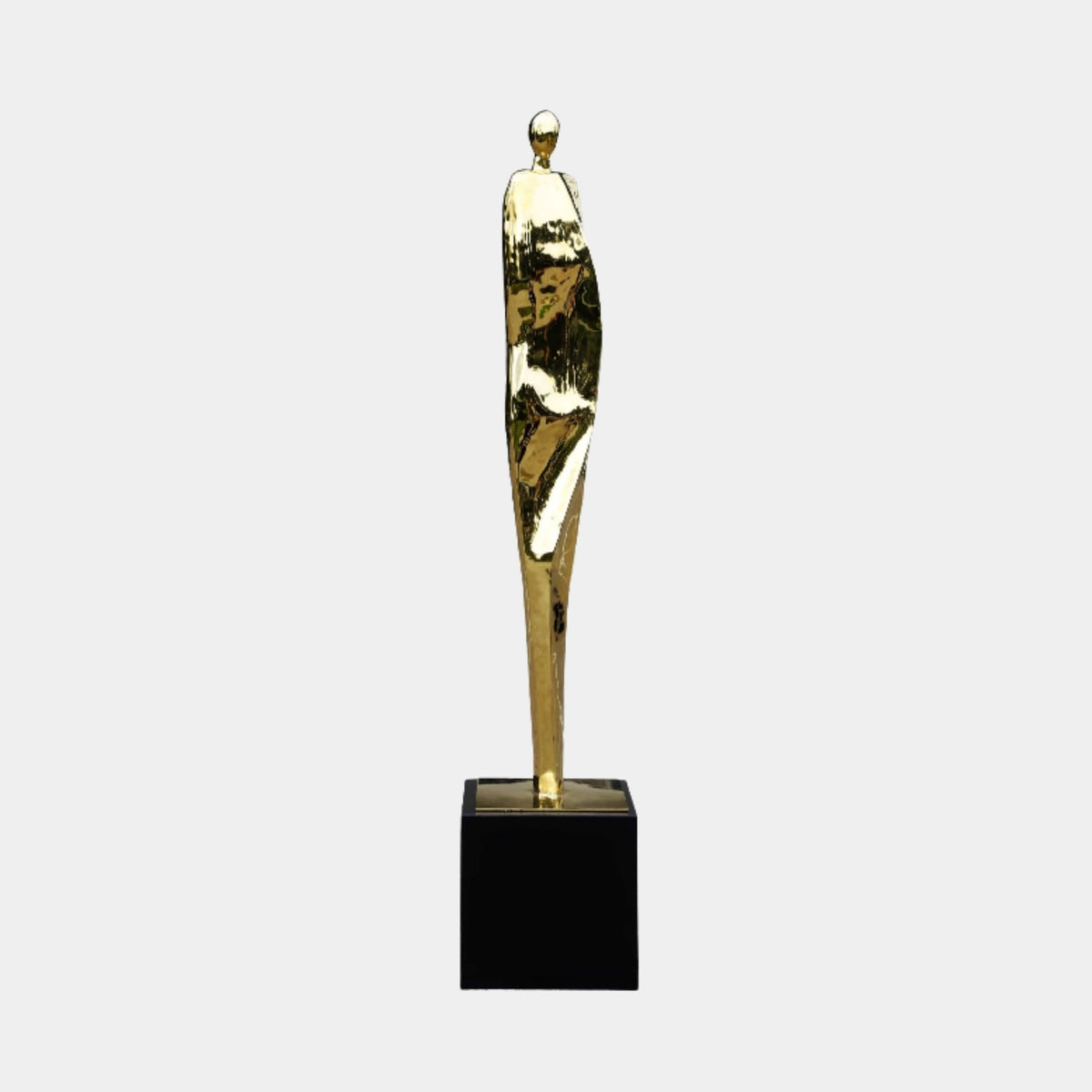 Gold Slender Standing Figure on Black Marble Base metal sculpture, 181cm, elongated abstract figure on a black marble base, plain light background.