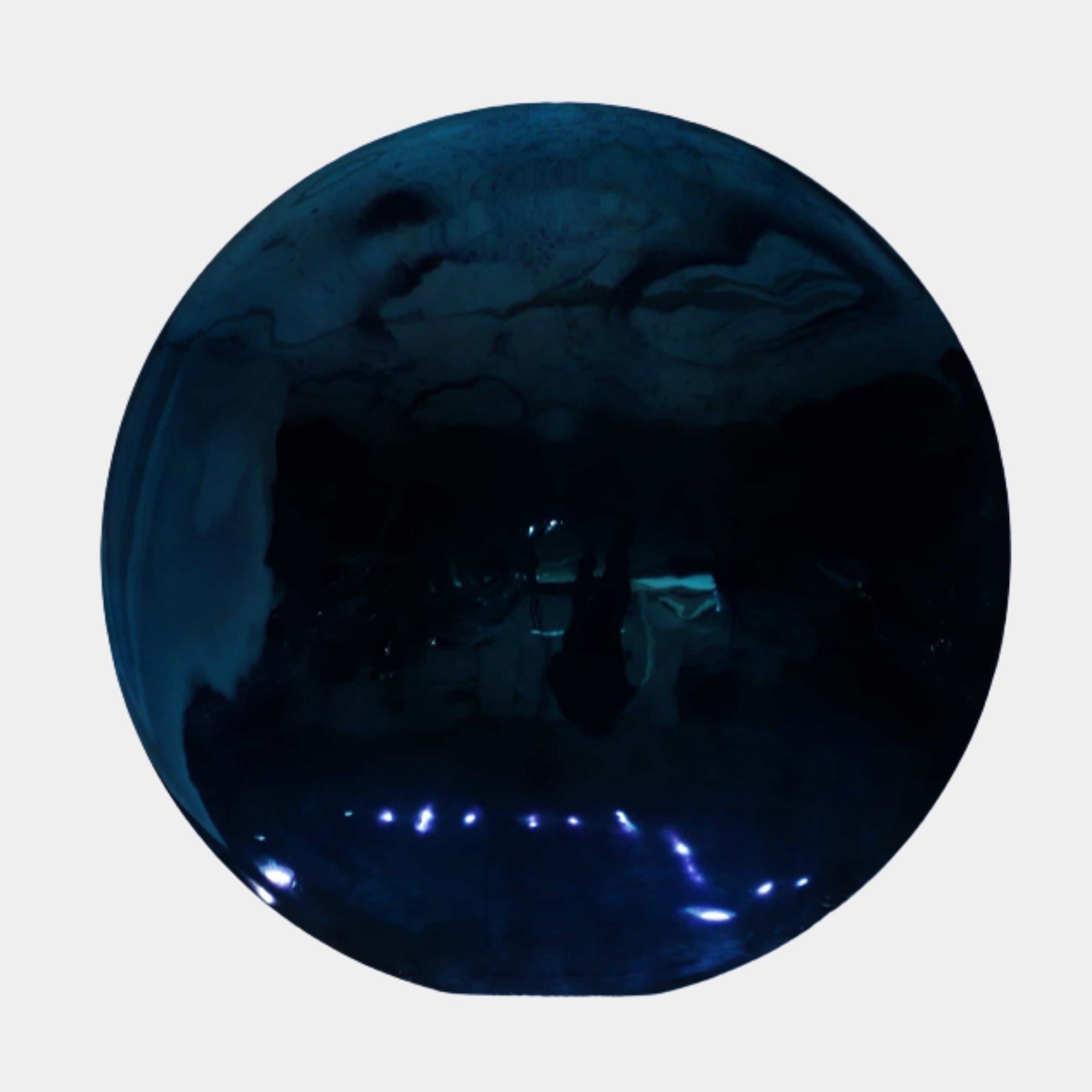 Blue Disc Stainless Steel Wall Art - 100cm, a circular mirror-polished disc reflecting a dim room with scattered blue LED lights, set against a plain light background.