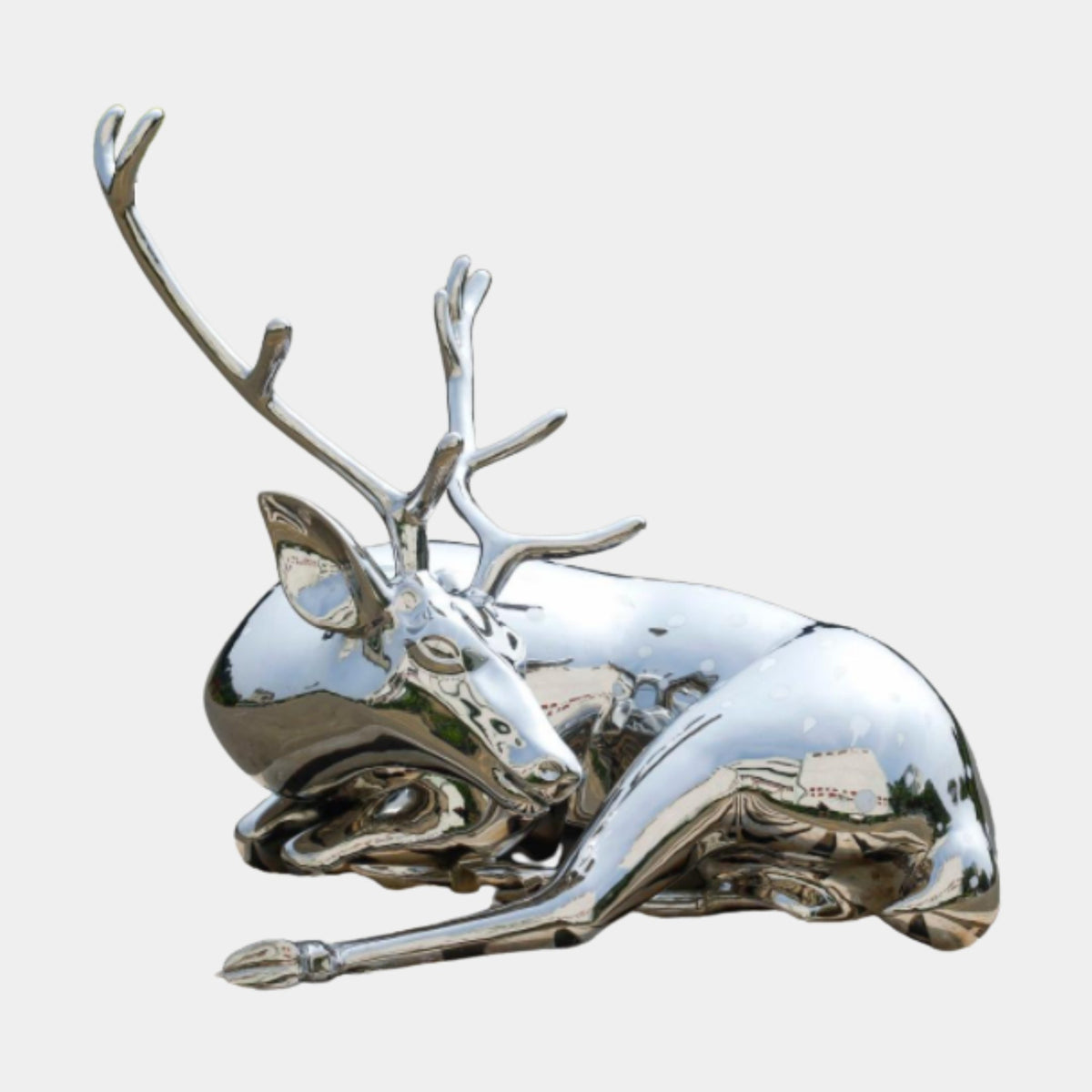 Silver Mirror-Polished Reclining Deer Stainless Steel Sculpture, 113cm, with large antlers, shown on a plain white background.