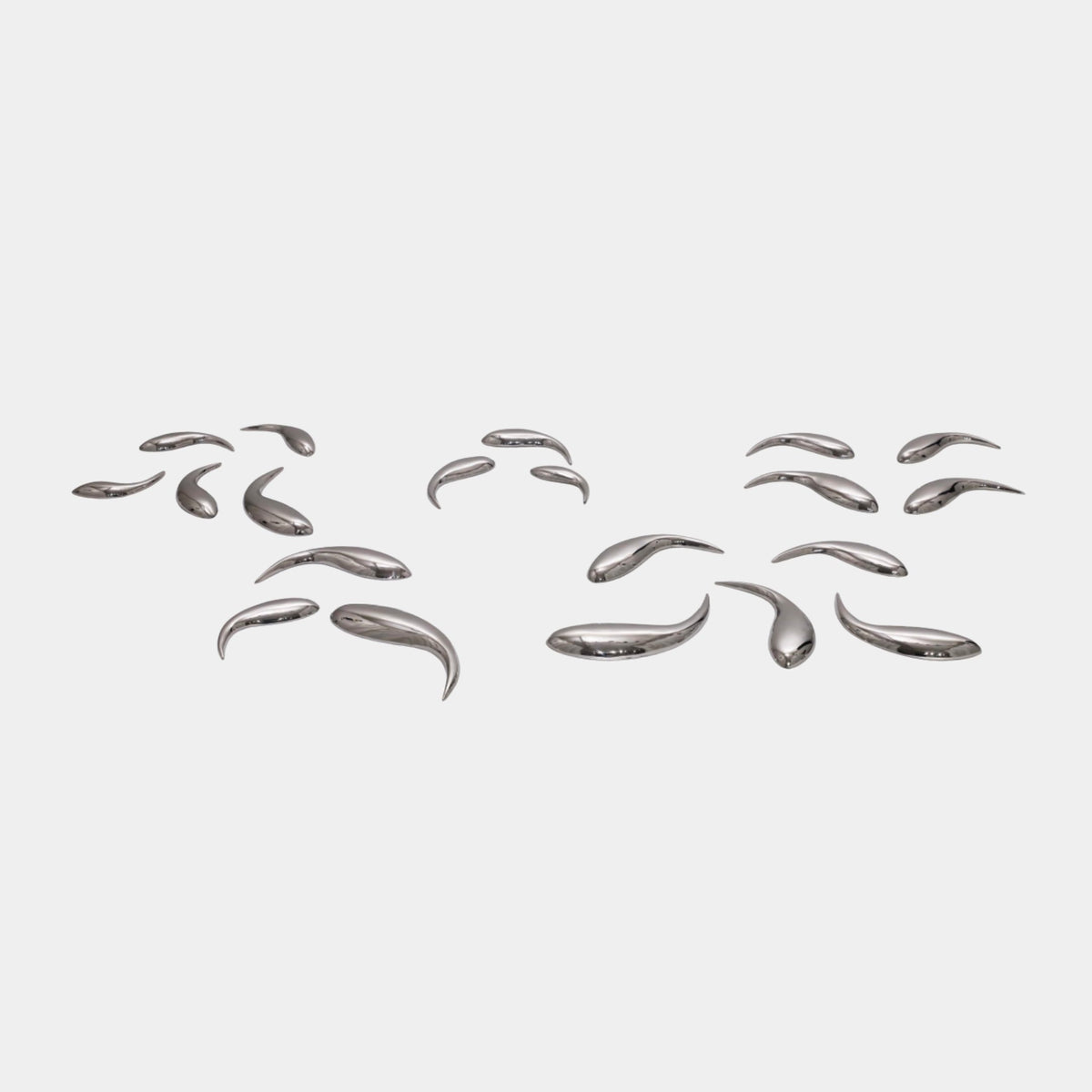 Silver Mirror-Polished Swimming Fish Group Stainless Steel Sculpture, 15cm, scattered curved fish forms on a plain white background.