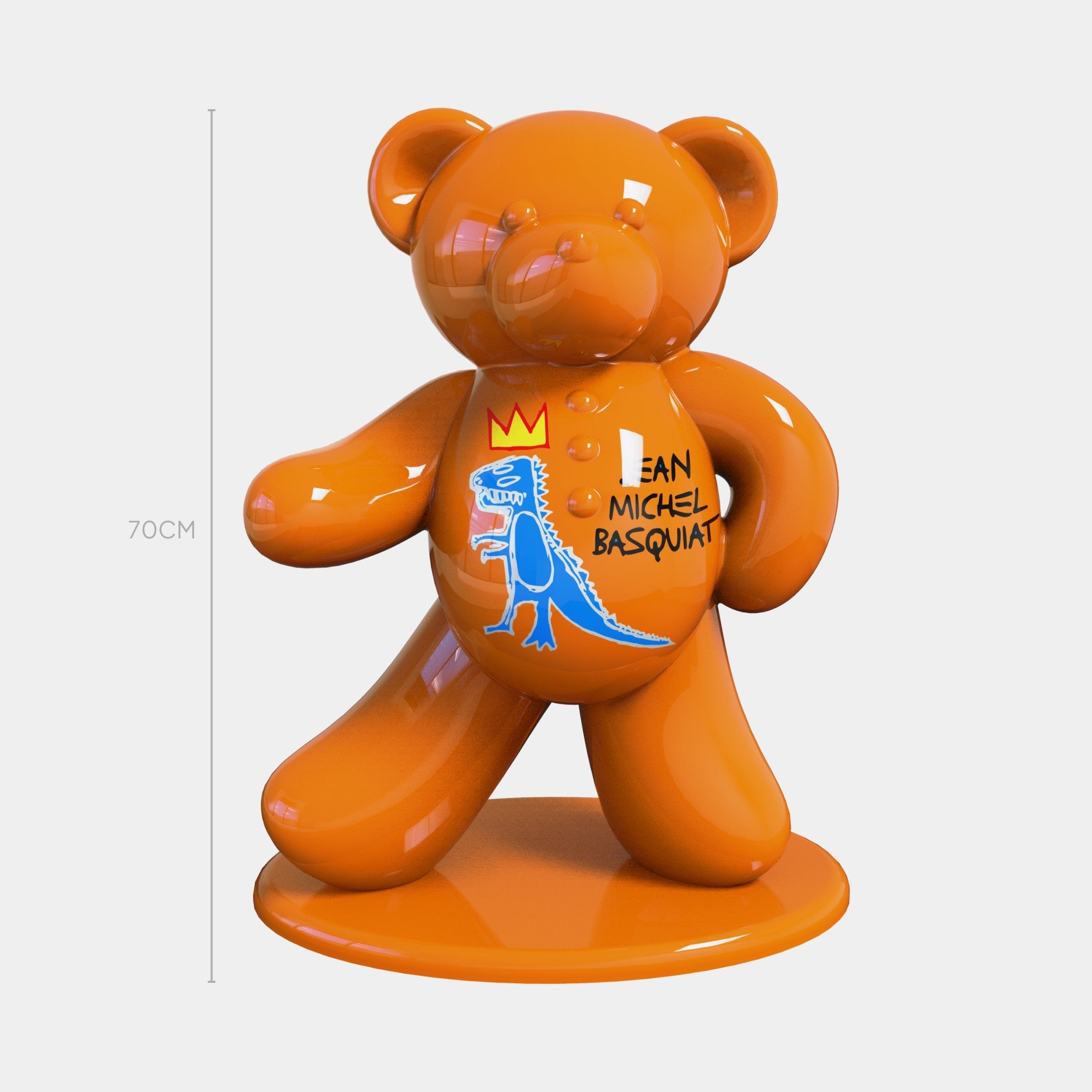 The Gacko Basquiat Bear Sculpture by Giant Sculptures stands 70cm tall, featuring a glossy orange finish and bold graffiti art—including a crown, blue dinosaur, and "Jean Michel Basquiat"—for striking street-art inspired decor.