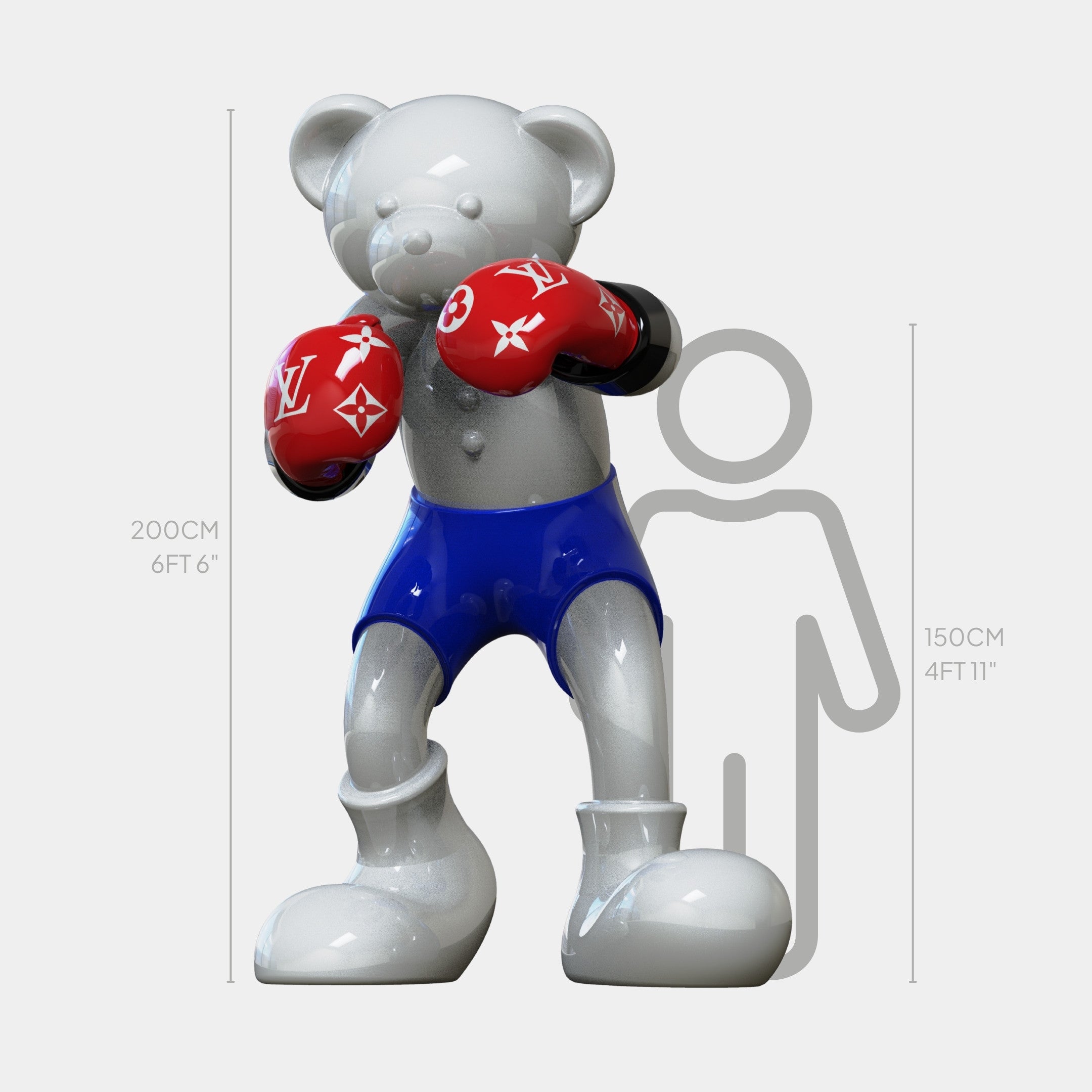 The Gacko Grey & Red LV Boxer Bear Sculpture by Giant Sculptures stands 200cm tall, towering over a 150cm human figure, and features blue shorts, oversized red gloves, and a glossy designer finish.