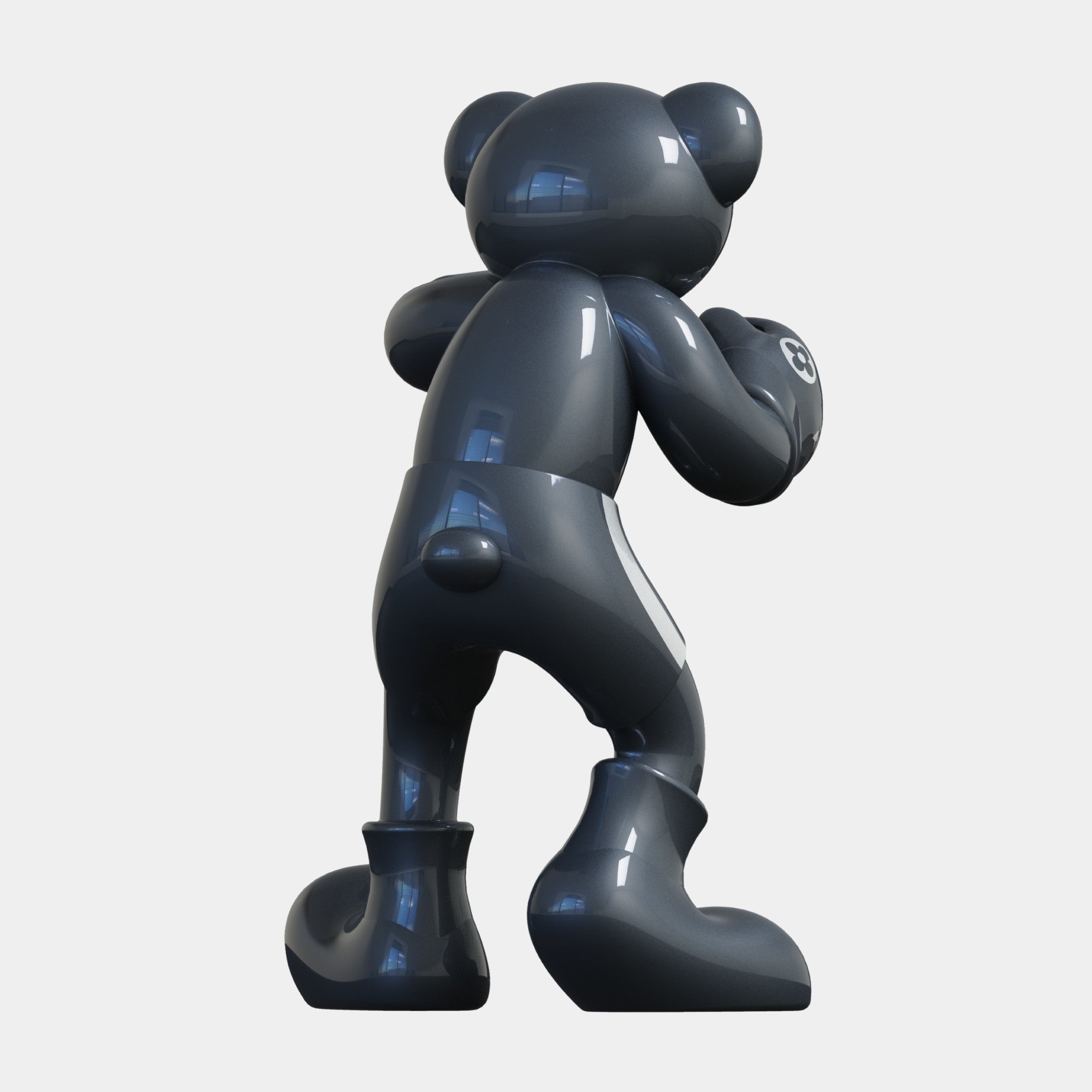 The Gacko Grey LV Boxer Bear Sculpture - 200cm by Giant Sculptures stands with its back turned, arms bent, and head slightly right. Its glossy dark gray finish features reflective surfaces that capture light and window reflections.