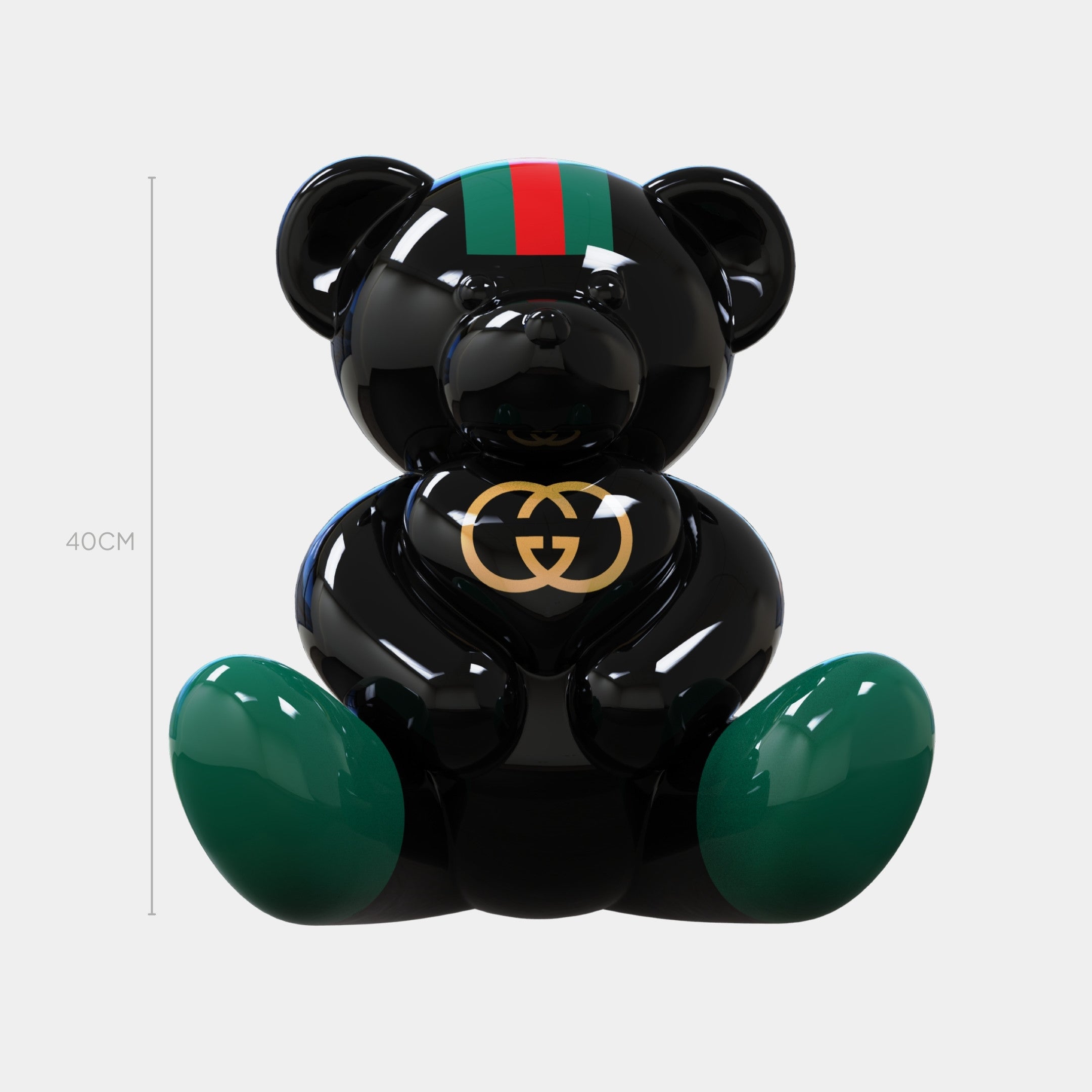 The Gacko Gucci Love Bear Sculpture by Giant Sculptures stands 40cm tall, features a glossy black finish, green and red stripes, a gold GG logo on its chest, and is perfect for luxury-inspired decor.