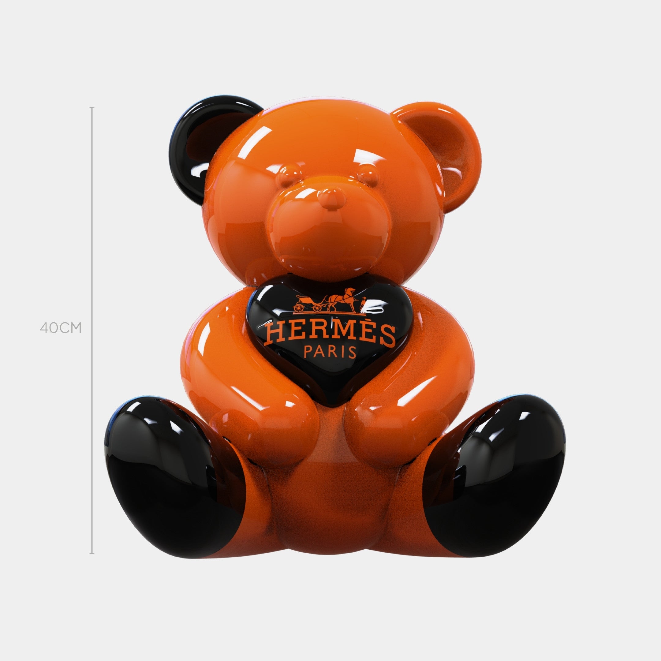 The Gacko Hermes Love Bear Sculpture - 40cm by Giant Sculptures features a glossy orange and black bear holding a black heart with the Hermès Paris logo, making it a standout luxury decor piece against a plain white background.