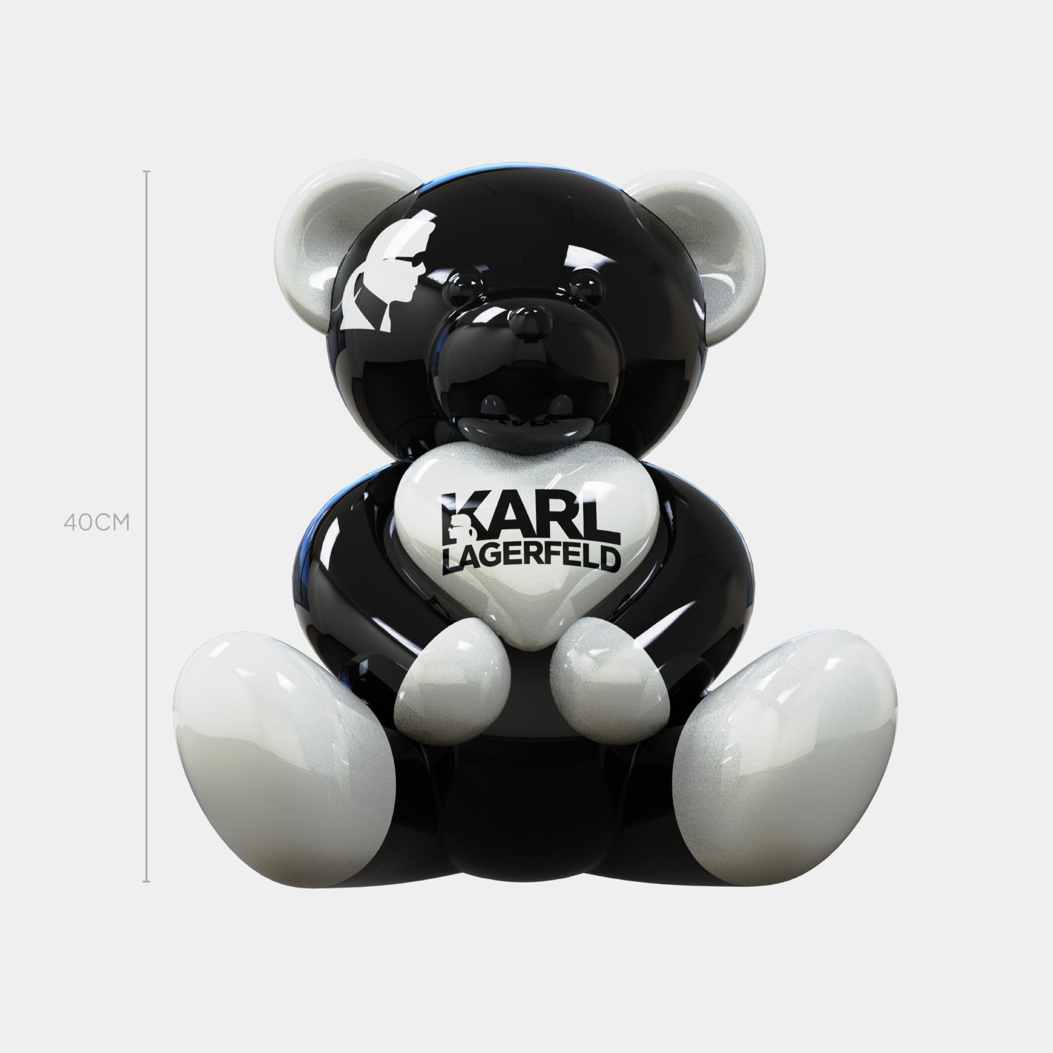 The Gacko Karl Lagerfeld Love Bear Sculpture by Giant Sculptures is a 40cm tall glossy black and white pop art teddy bear figurine holding a heart with “KARL LAGERFELD,” shown upright against a plain white background.