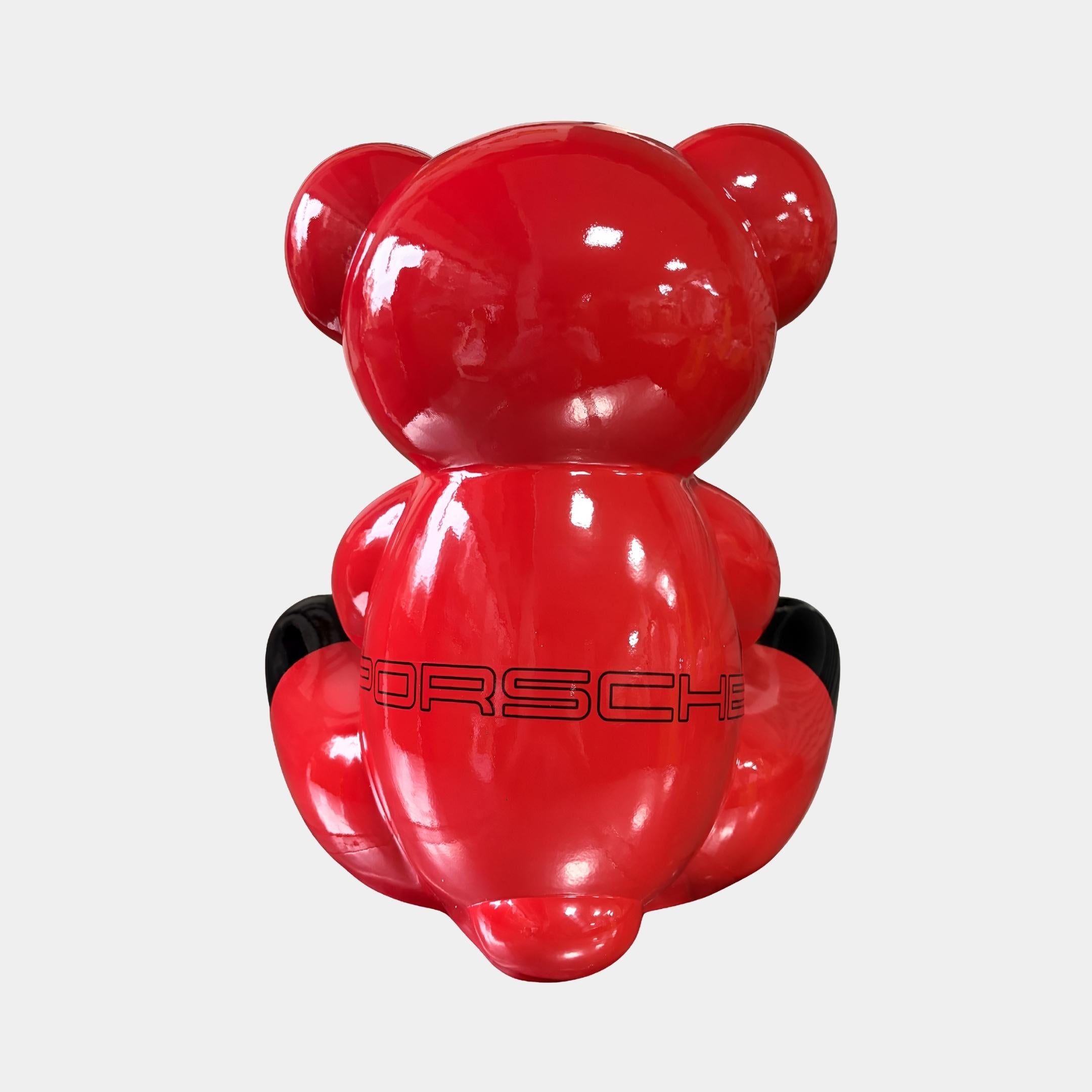 Rear view of the 40cm Gacko Porsche Love Bear Sculpture, showing the PORSCHE wordmark worked in tonal red-on-red relief across the back and the gloss black paws.
