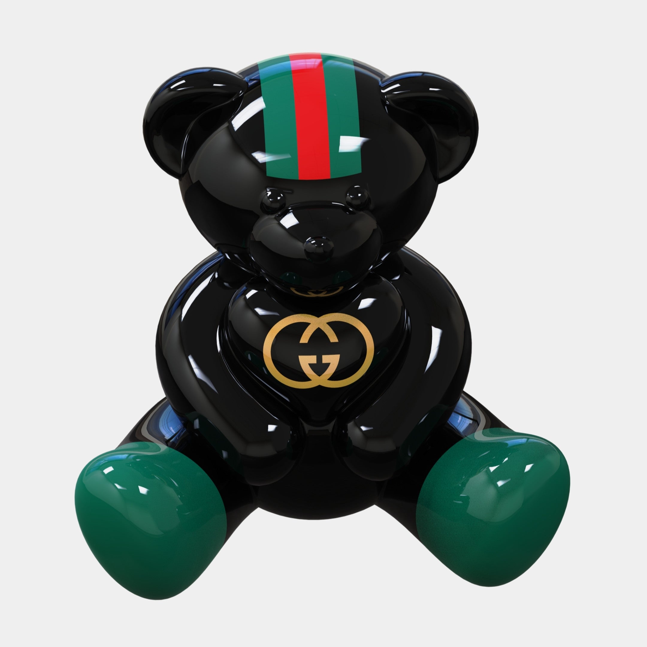 The Gacko Gucci Love Bear Sculpture - 80cm by Giant Sculptures is a glossy black collectible with green and red stripes on its forehead, green feet, a gold Gucci logo on its chest, and a shiny surface. Limited edition pop art that sits upright.