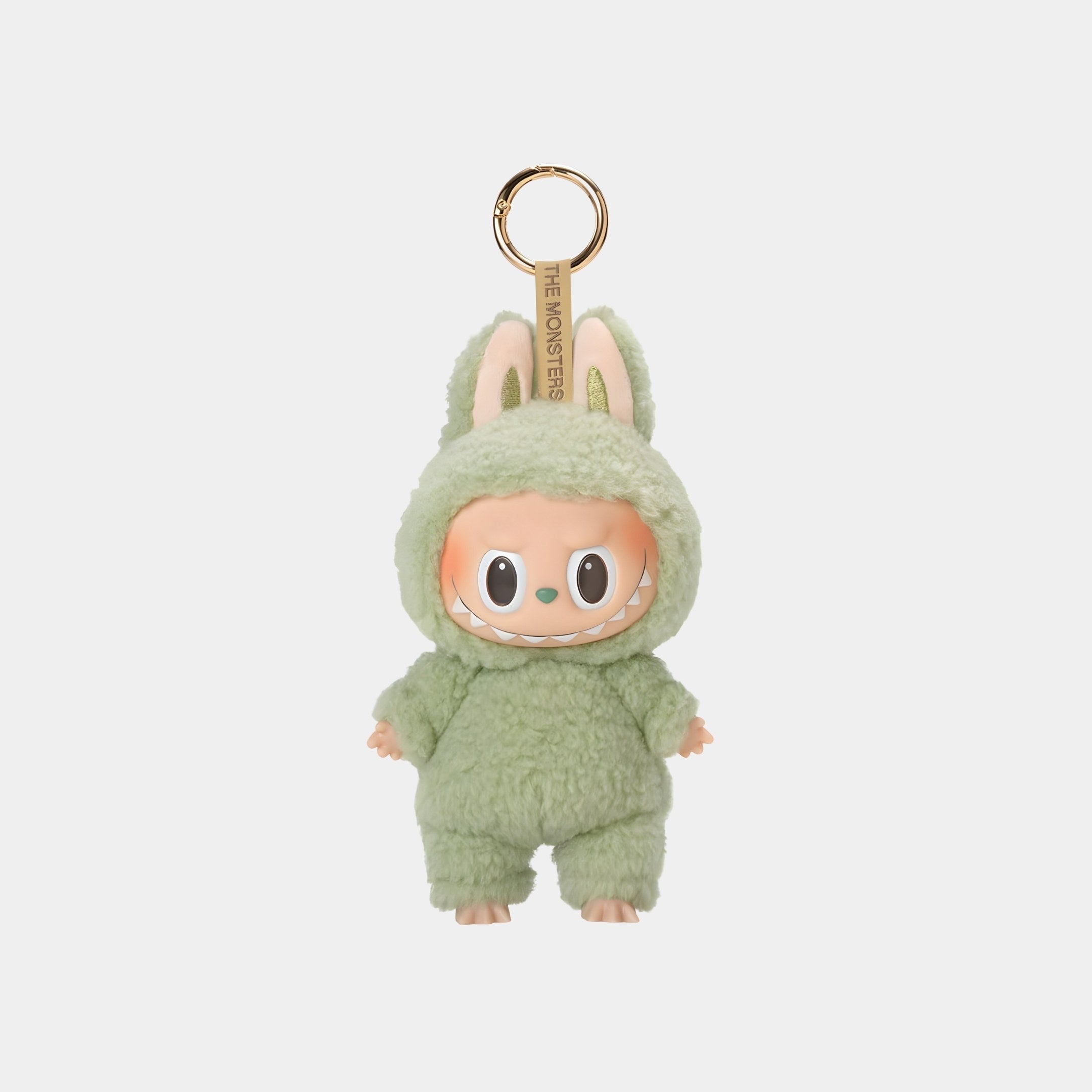 The Green Grape Macaron Labubu Keychain Figure by Giant Sculptures is a 15cm collectible plush charm, featuring Labubu in a fluffy green bunny costume with tall ears and a wide smile, attached to a gold-colored keyring.